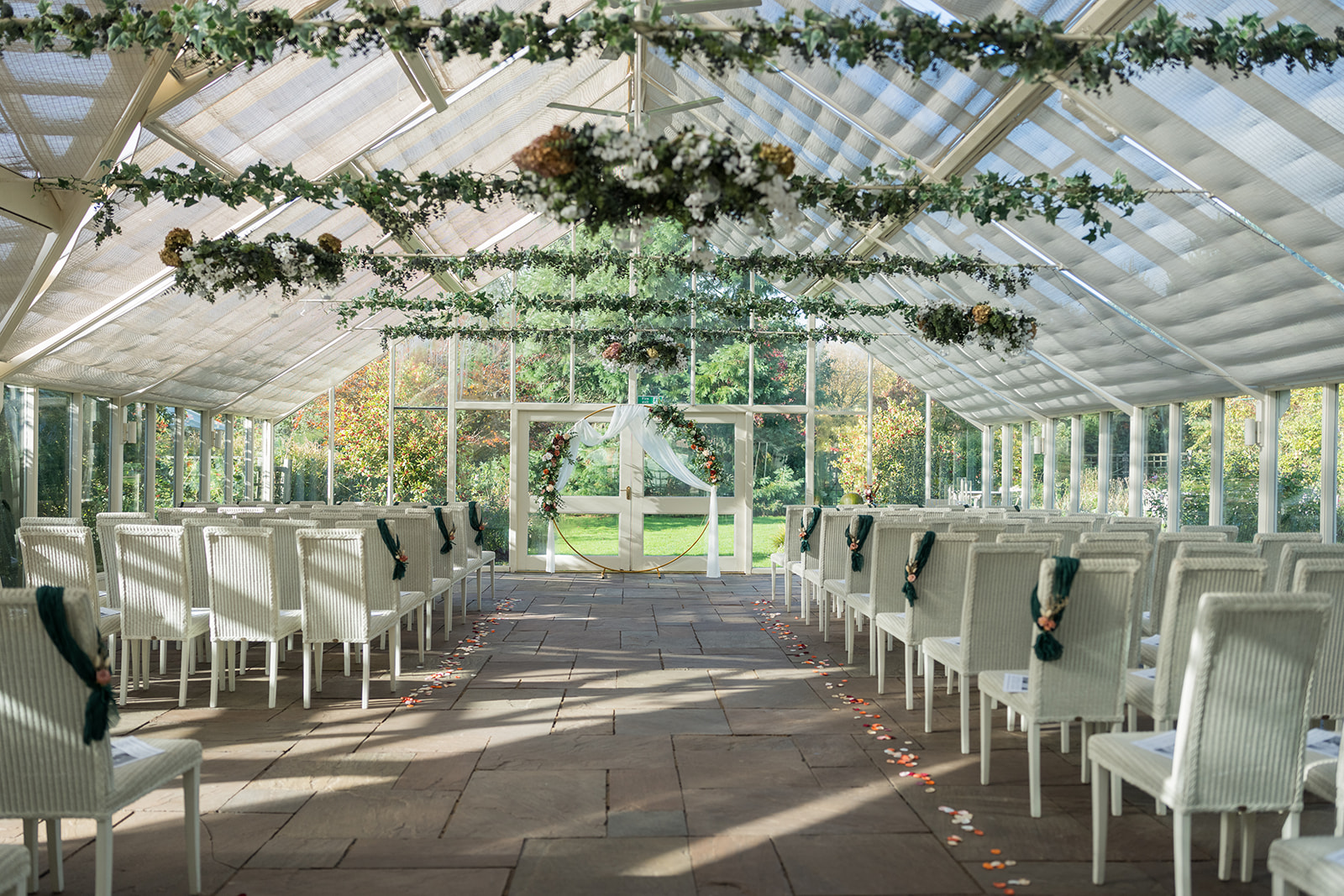 Abbeywood Estate glasshouse arranged for Gemma and James’s autumn wedding ceremony