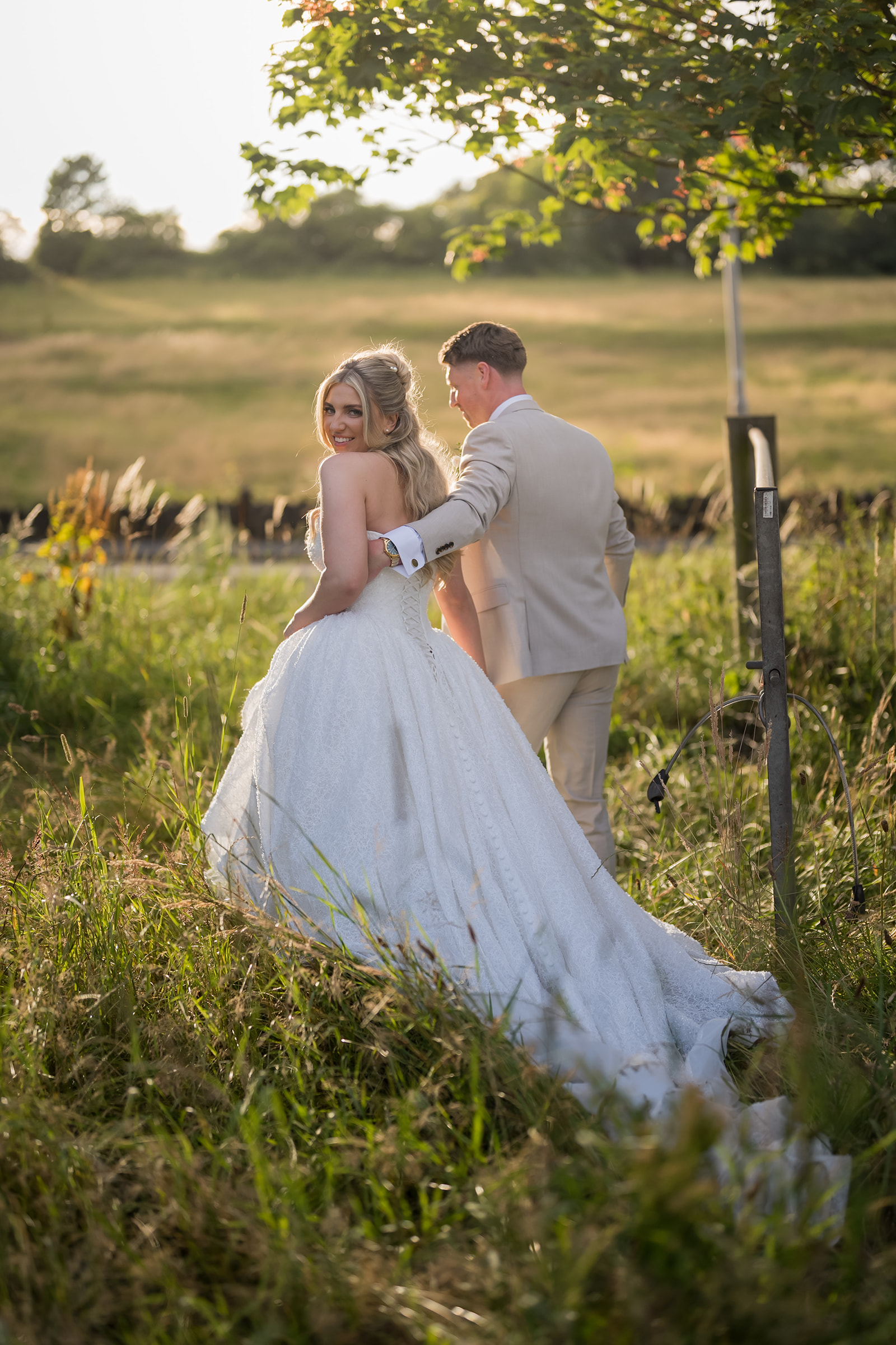 Chloe and James together in evening light in the grounds of Woodlands Hotel