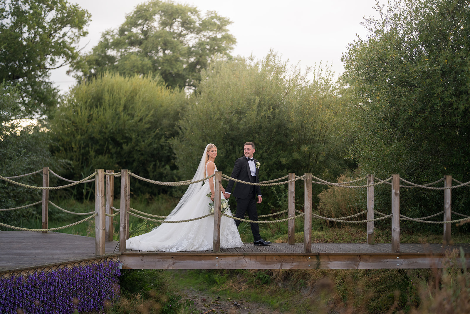Evie and Josh together on the garden bridge at Burlton Manor