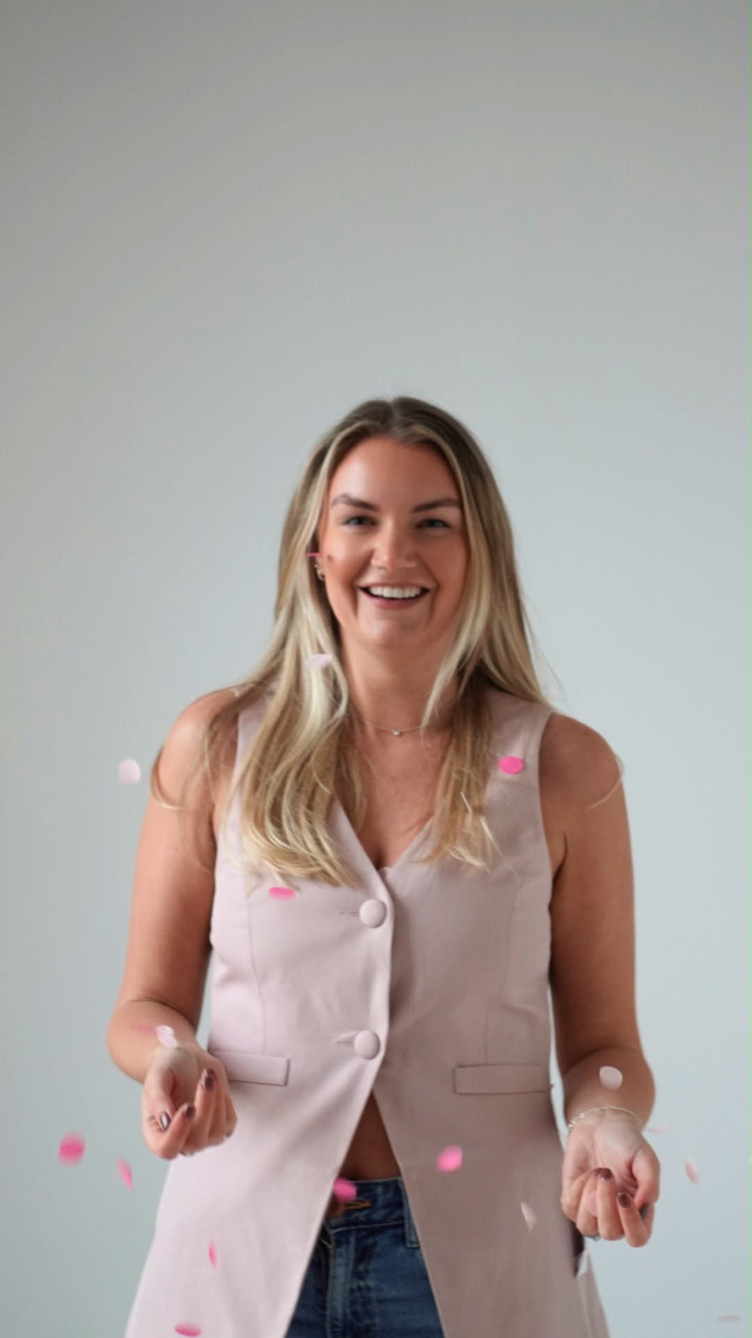 Gemma of Capture Our Day smiling as she tosses confetti