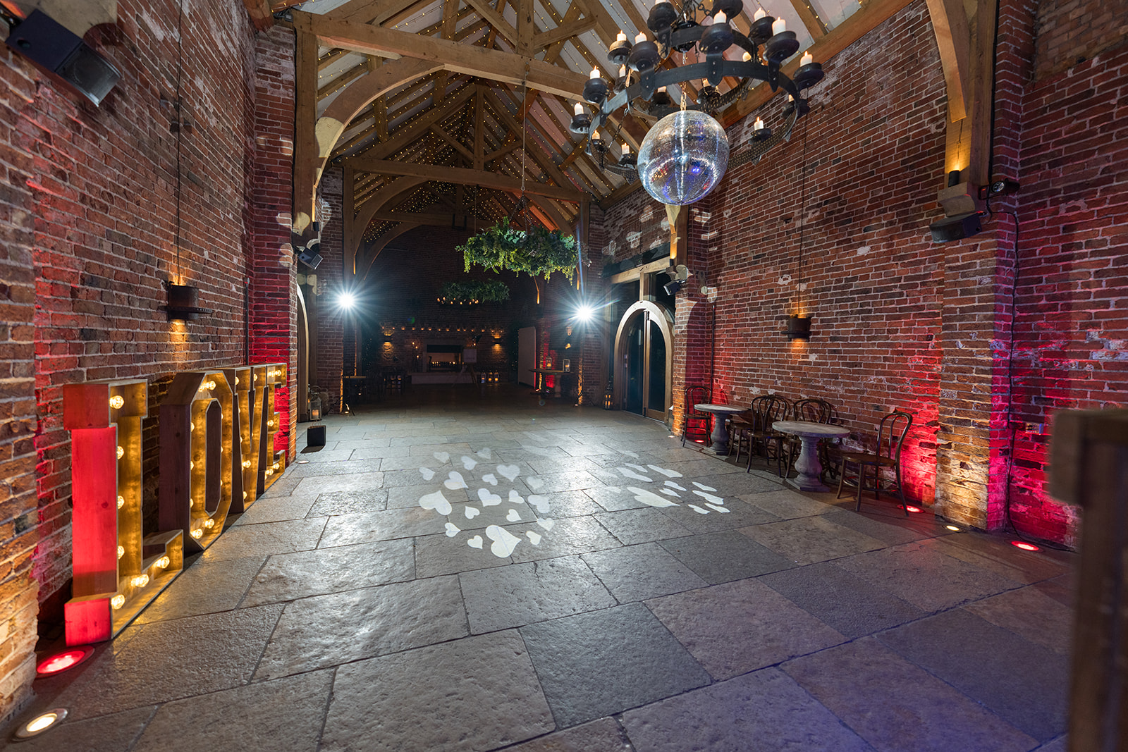 Hazel Gap Barn’s red-brick interior and timber roof prepared for the evening celebration