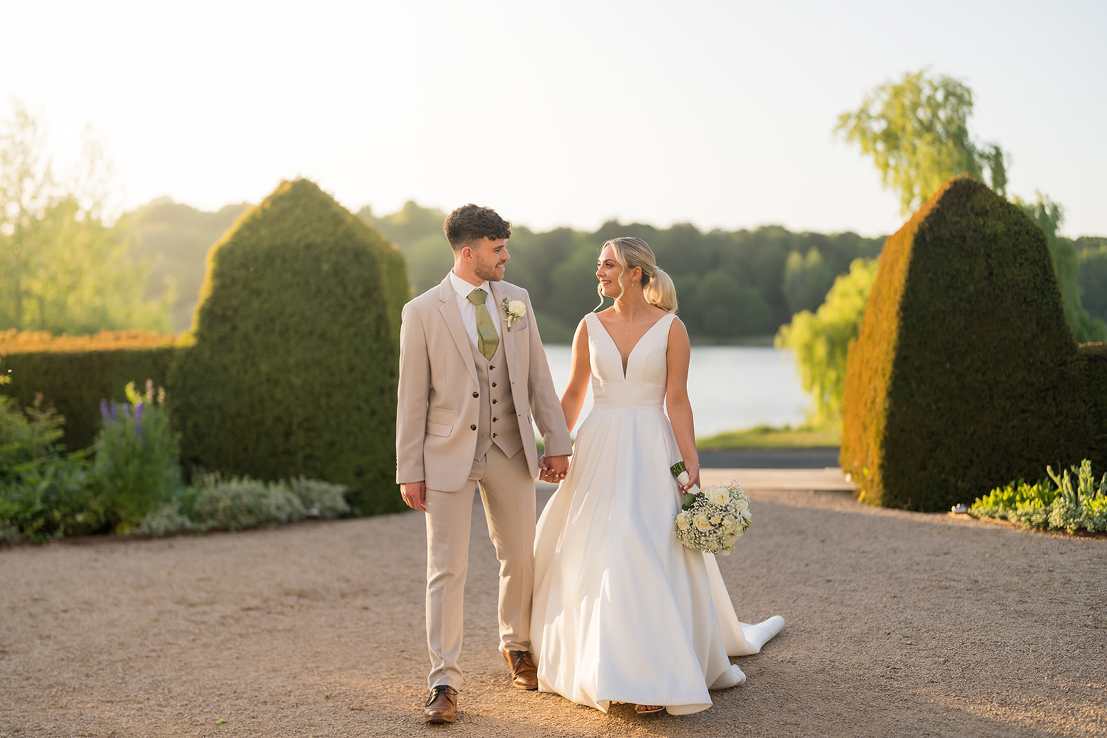 Jordan and Ben walking together beside the mere at Combermere Abbey