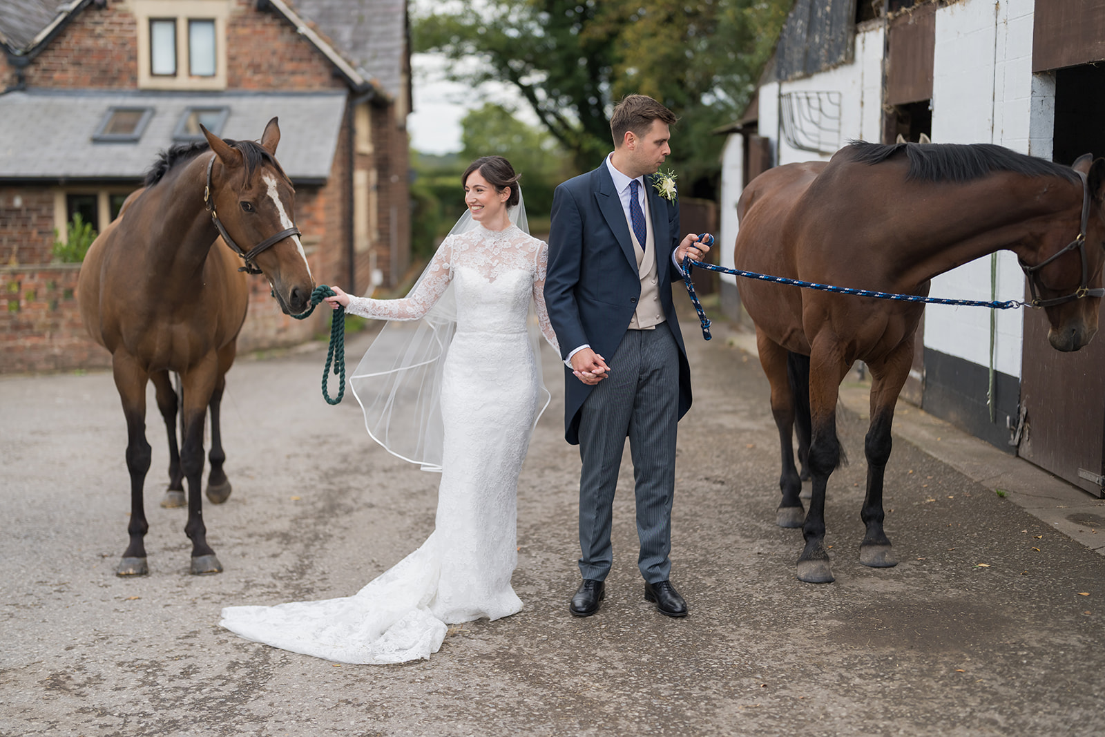Katie and John with their horses during their Cheshire wedding celebration