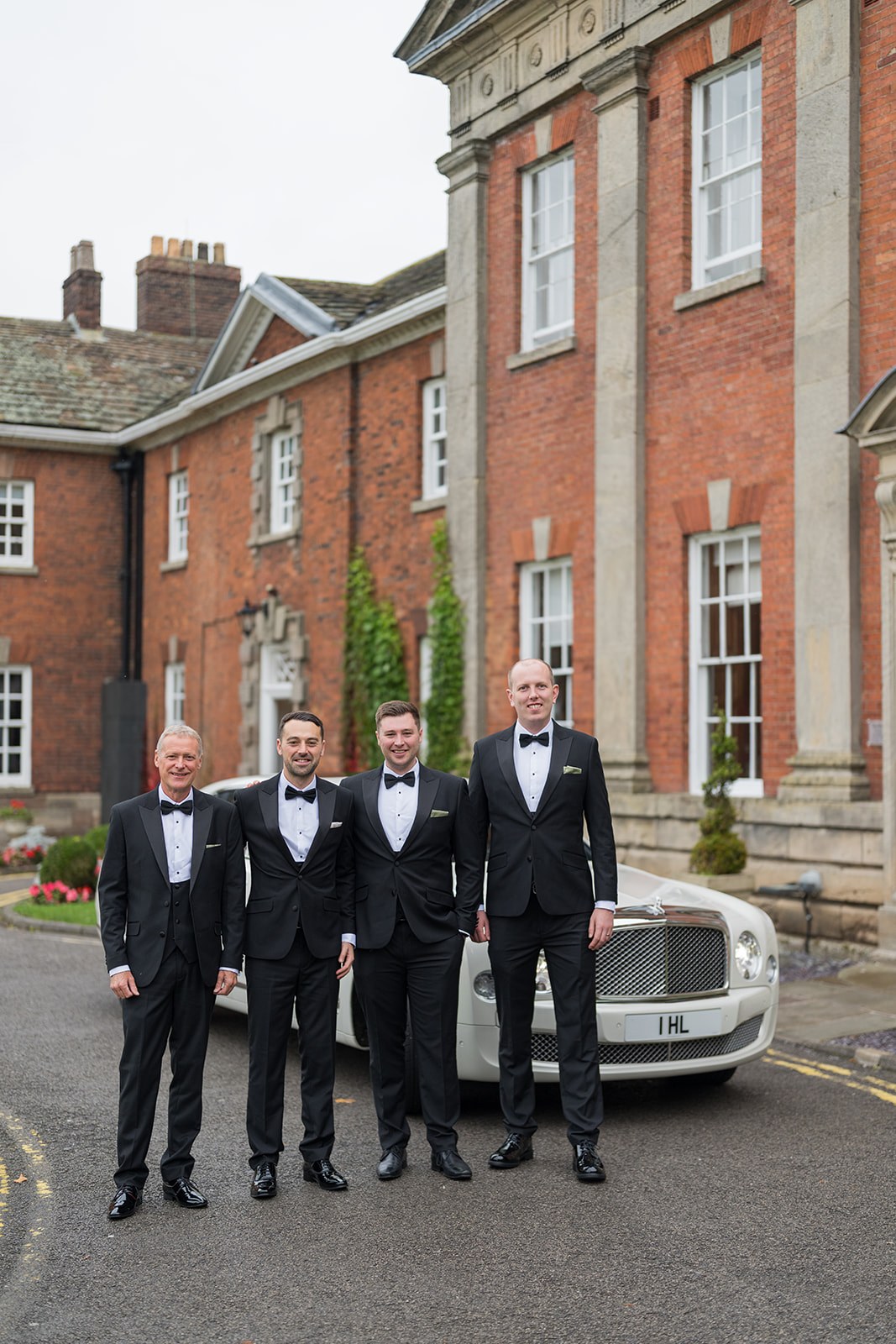 Groomsmen outside Mottram Hall
