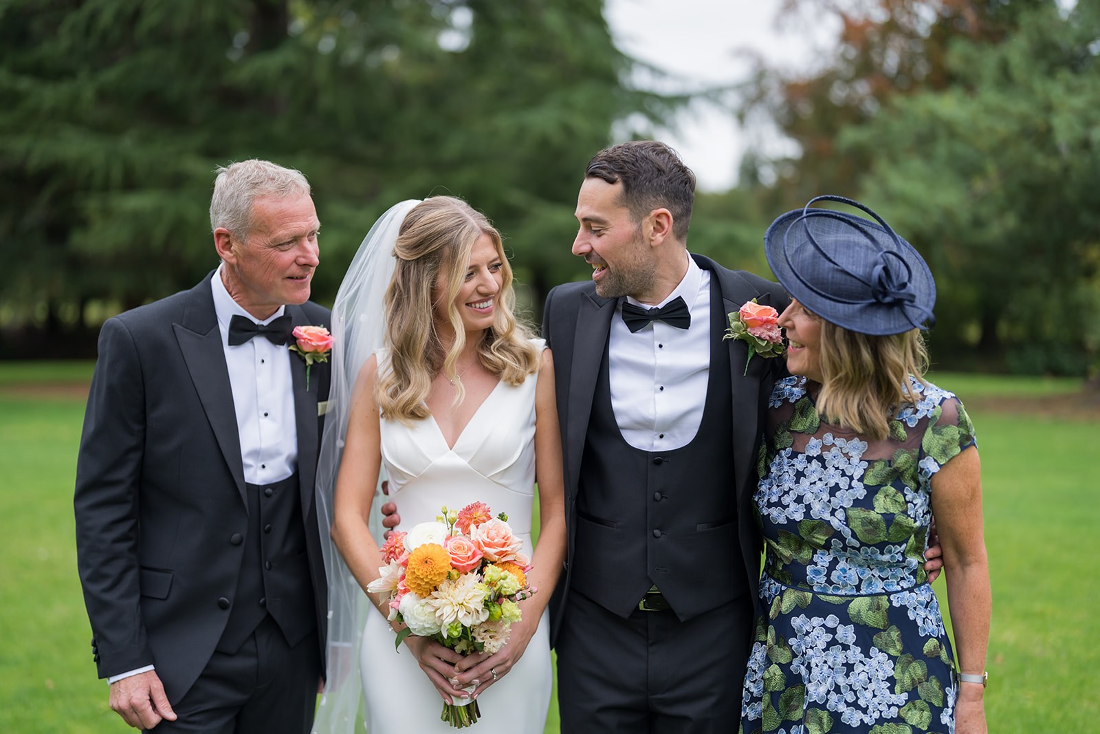A relaxed family moment in the gardens at Mottram Hall