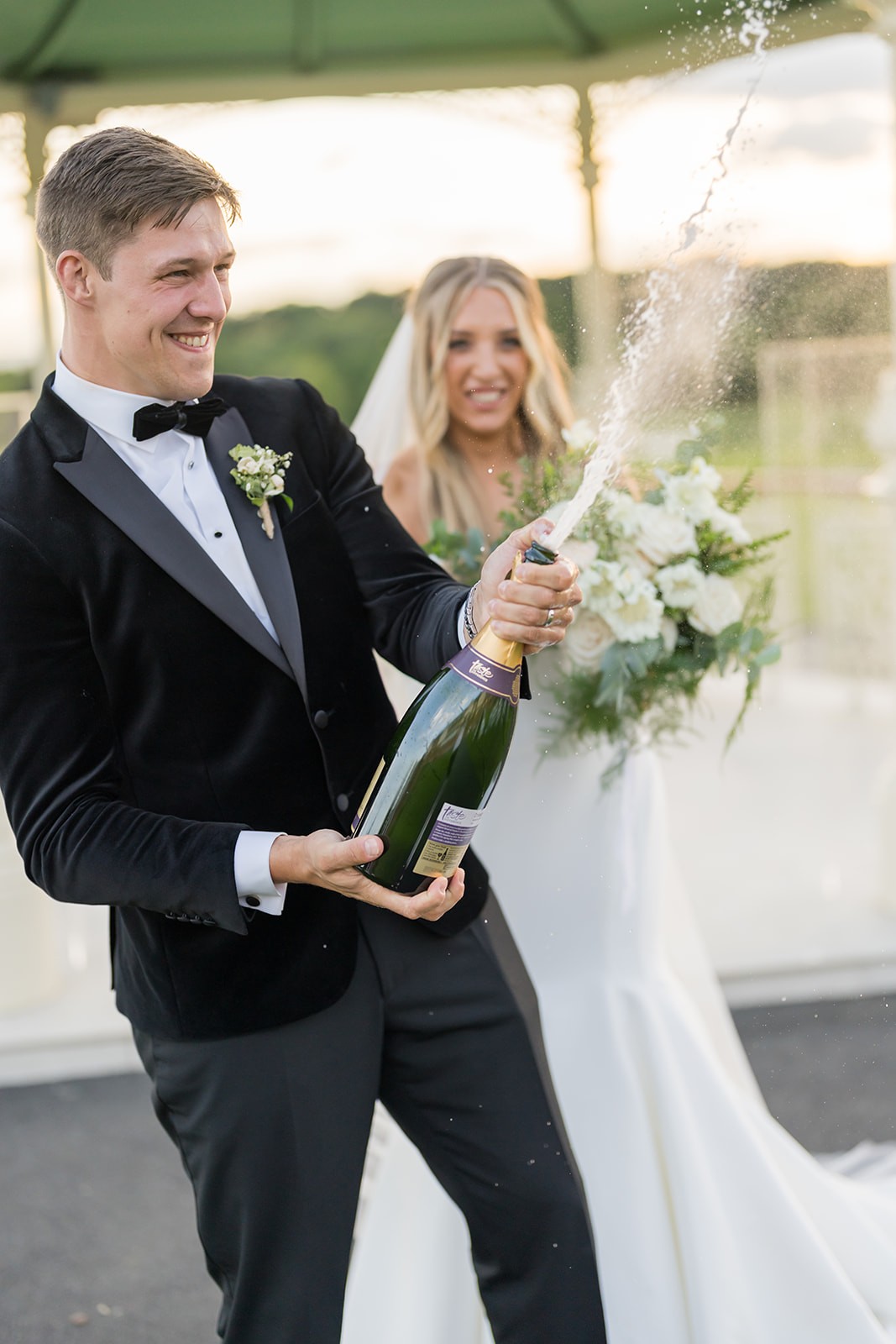 Bride and groom smiling during their ceremony