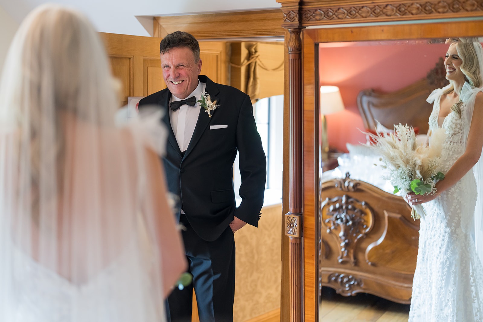 Groom smiling towards the bride during their ceremony