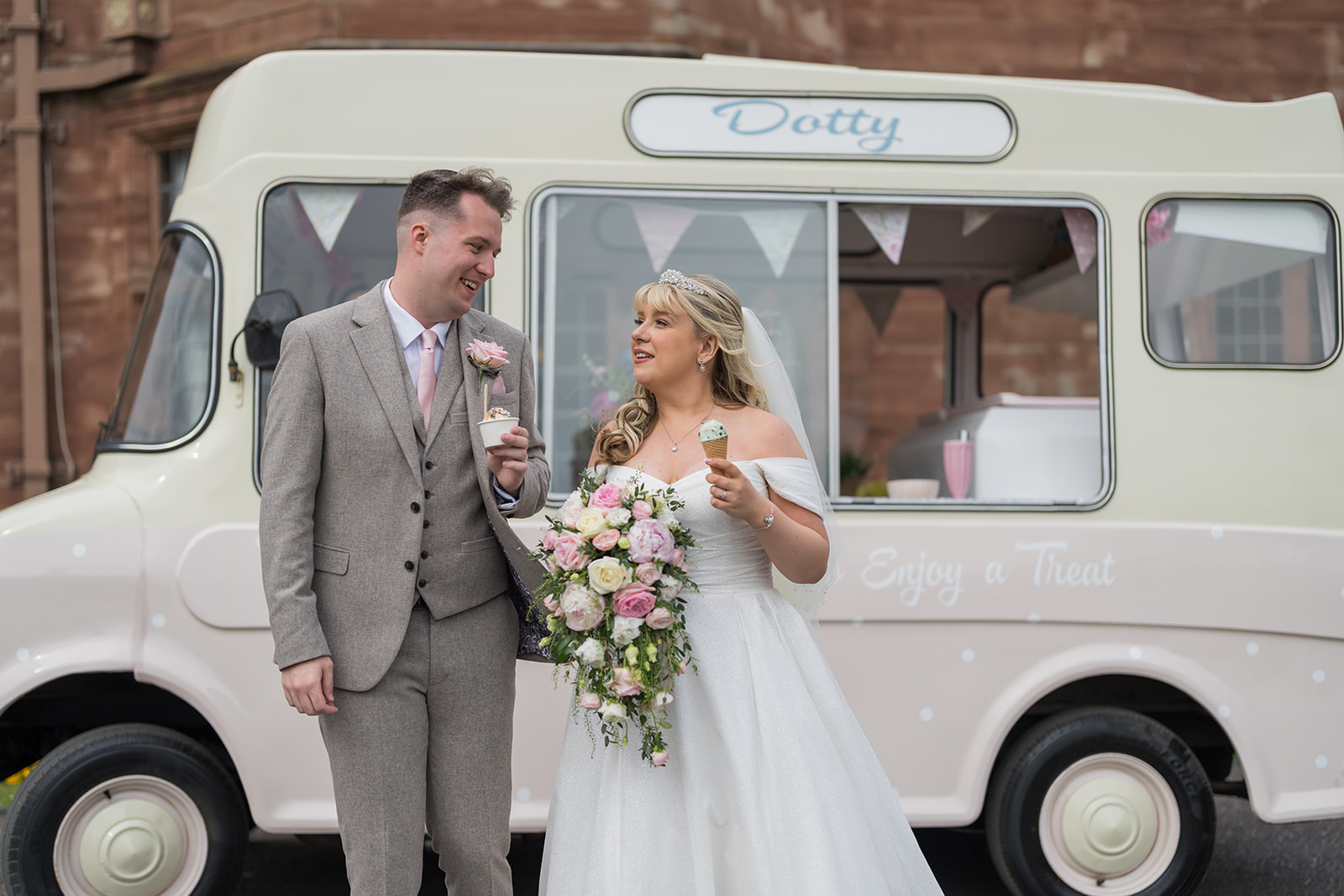 Newlyweds beside a vintage ice cream van