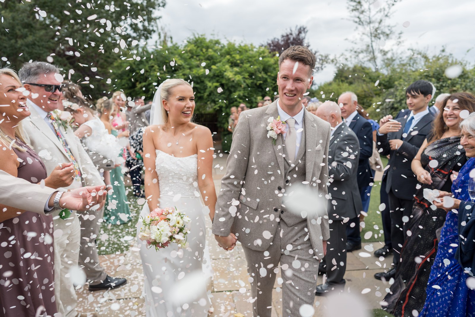 Harry and Jenny in a cloud of confetti at Pryors Hayes