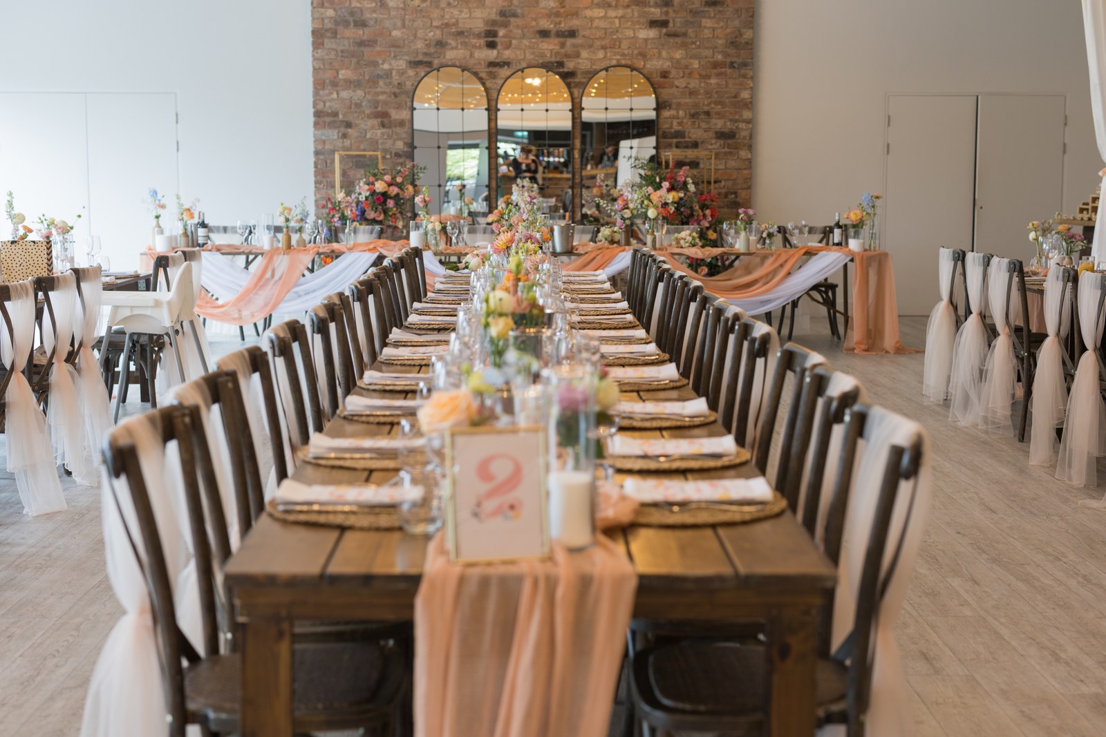 Long reception tables dressed for dinner at Pryors Hayes