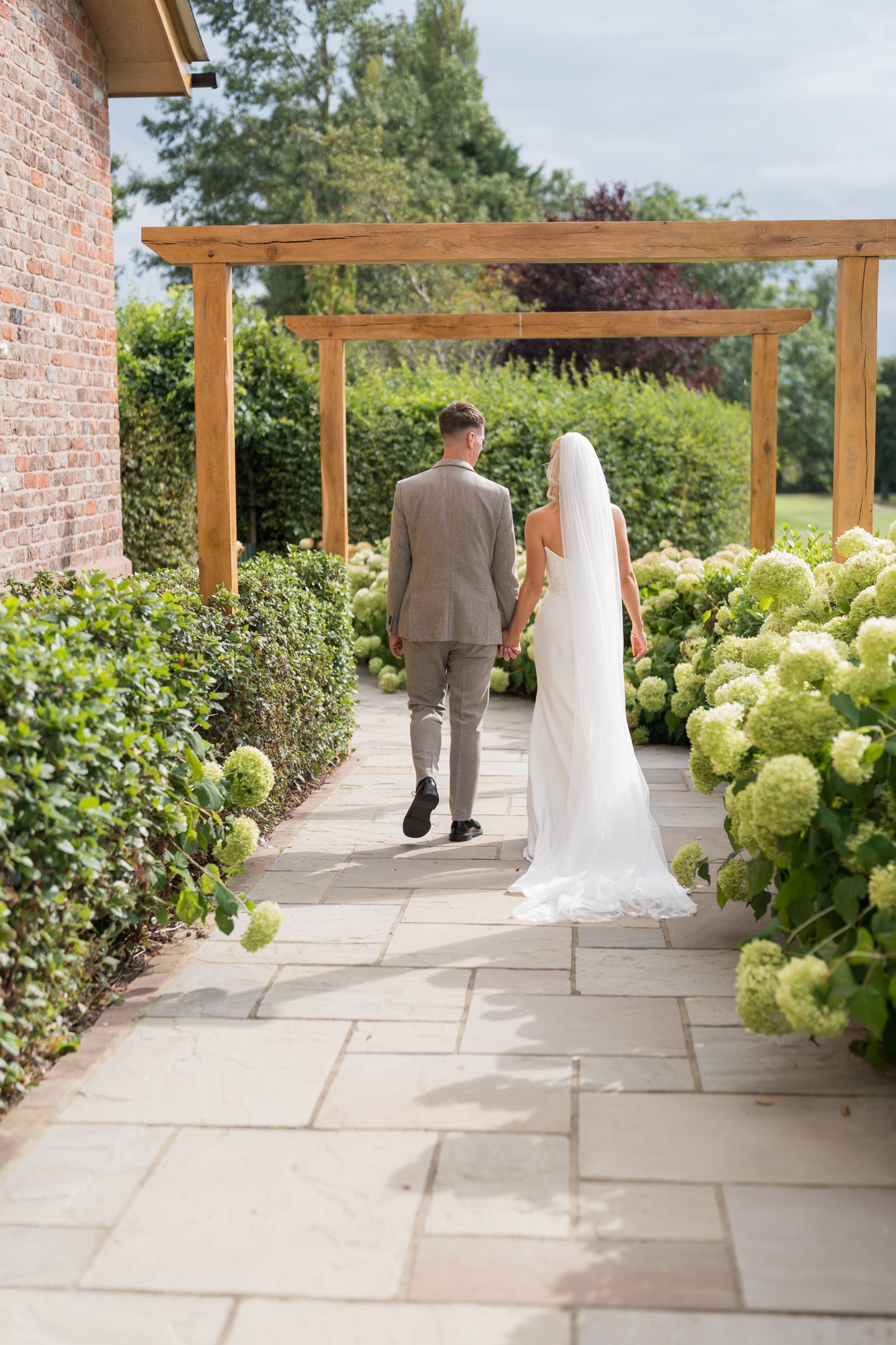 A portrait under the garden pergola at Pryors Hayes