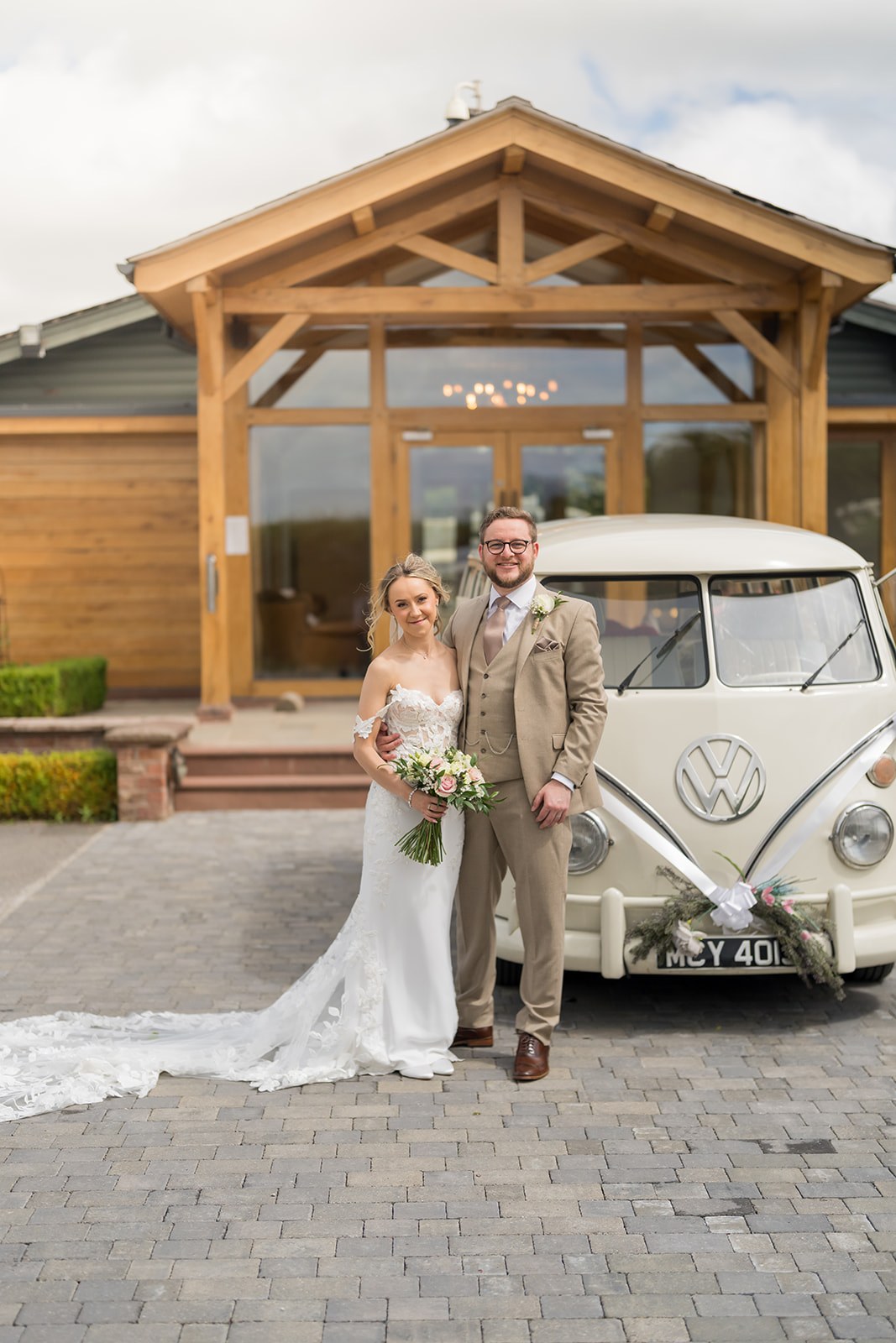 Kayleigh and Ryan beside their wedding car at Pryors Hayes