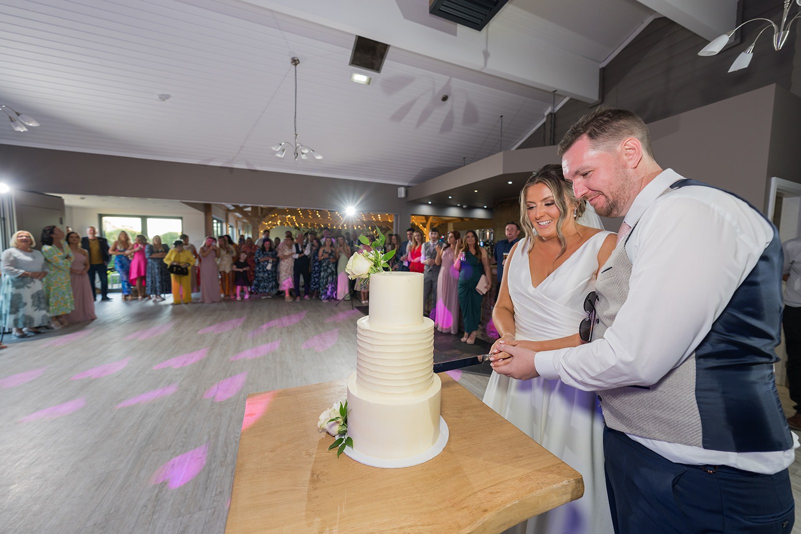 Cutting the wedding cake at Pryors Hayes
