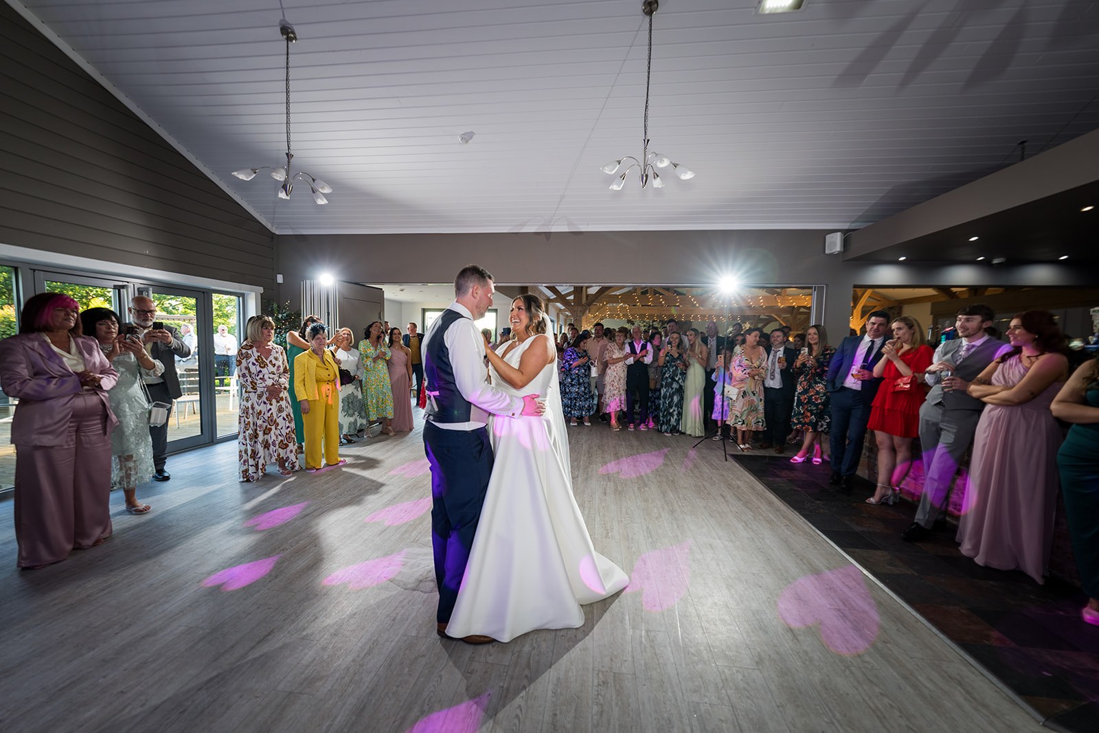 The first dance surrounded by guests at Pryors Hayes