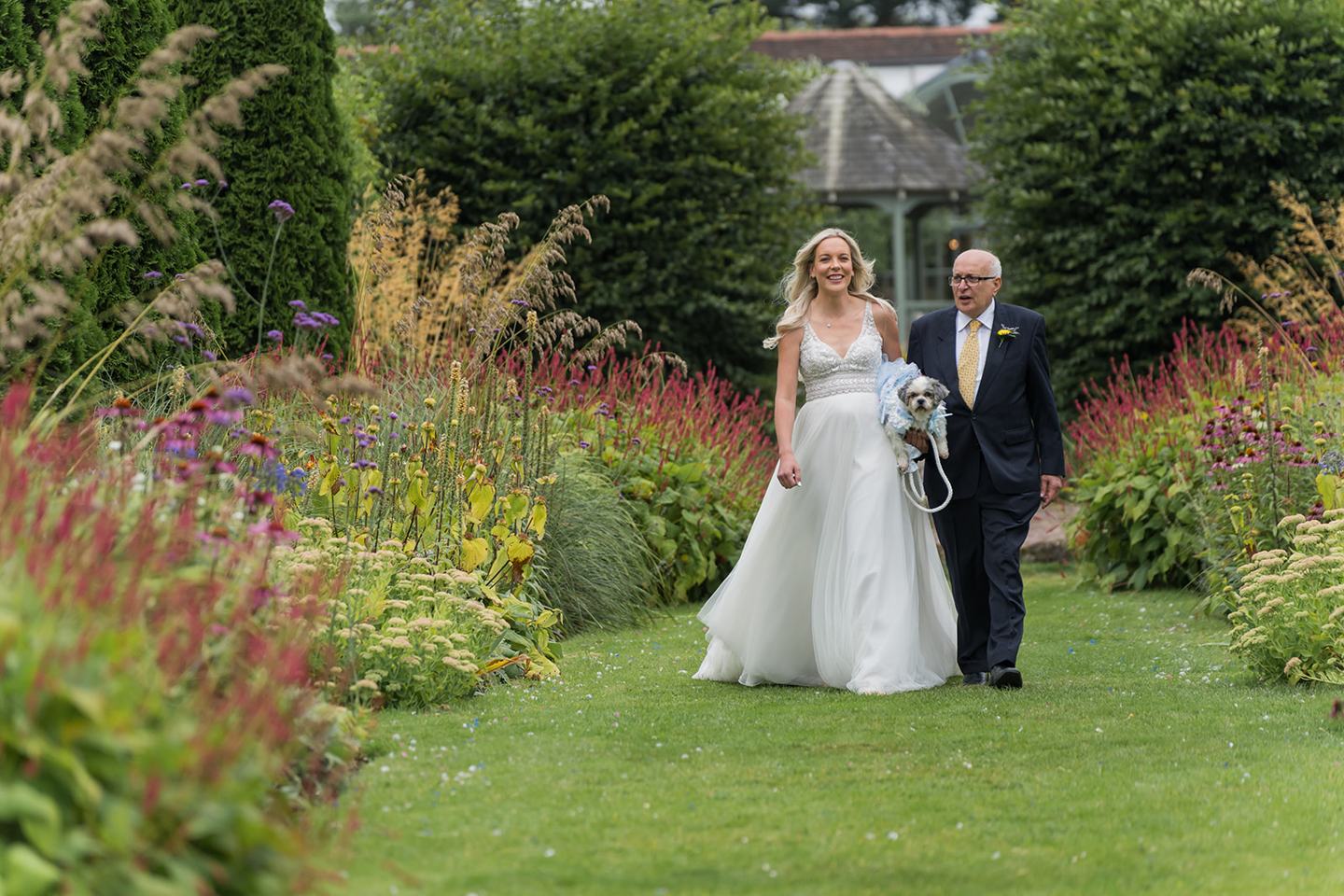 Bride arriving for the outdoor ceremony at Annie and Joe’s Abbeywood Estate wedding