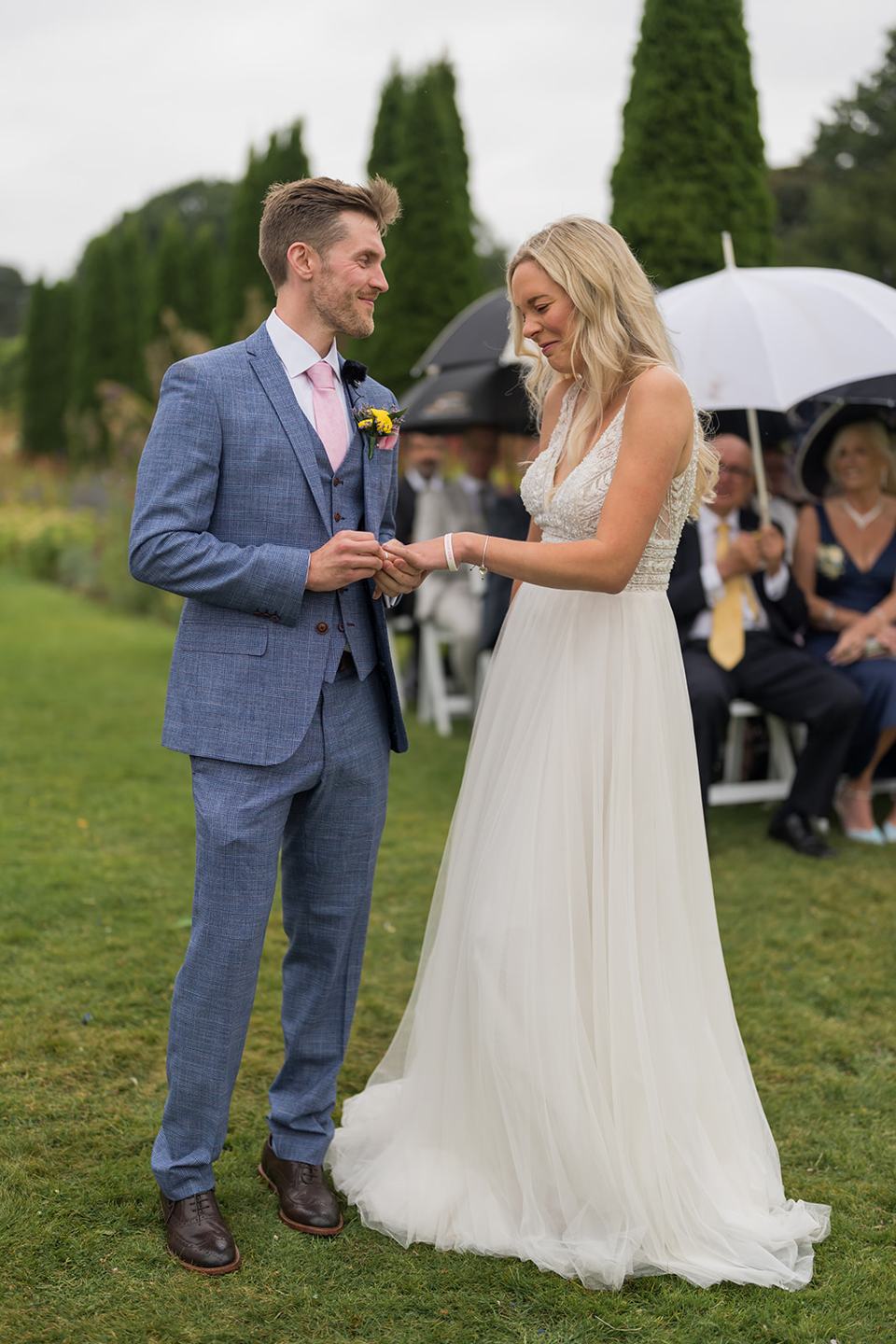 Exchanging rings at Annie and Joe’s Abbeywood Estate wedding