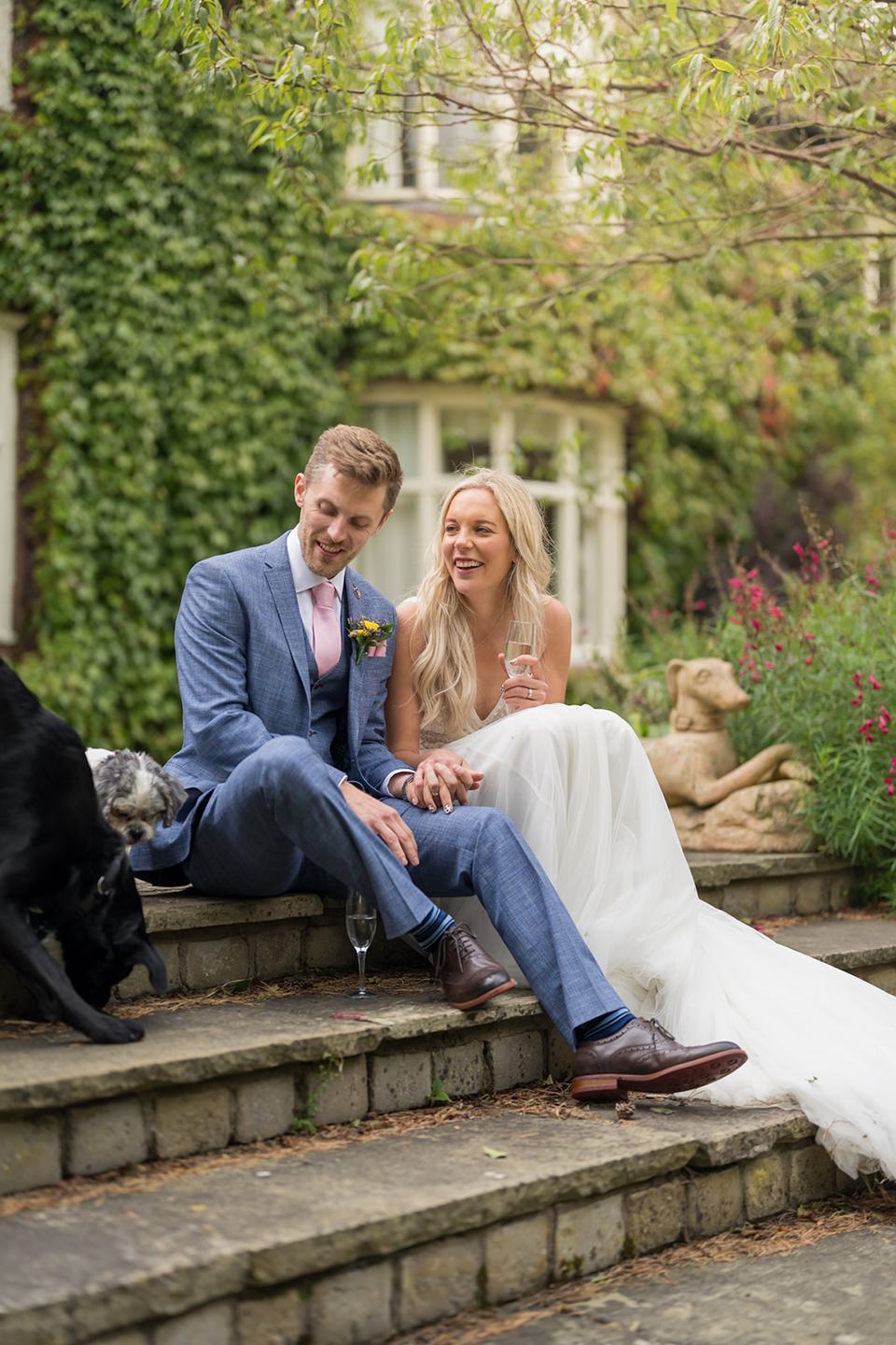 Newlyweds beside the house at Annie and Joe’s Abbeywood Estate wedding