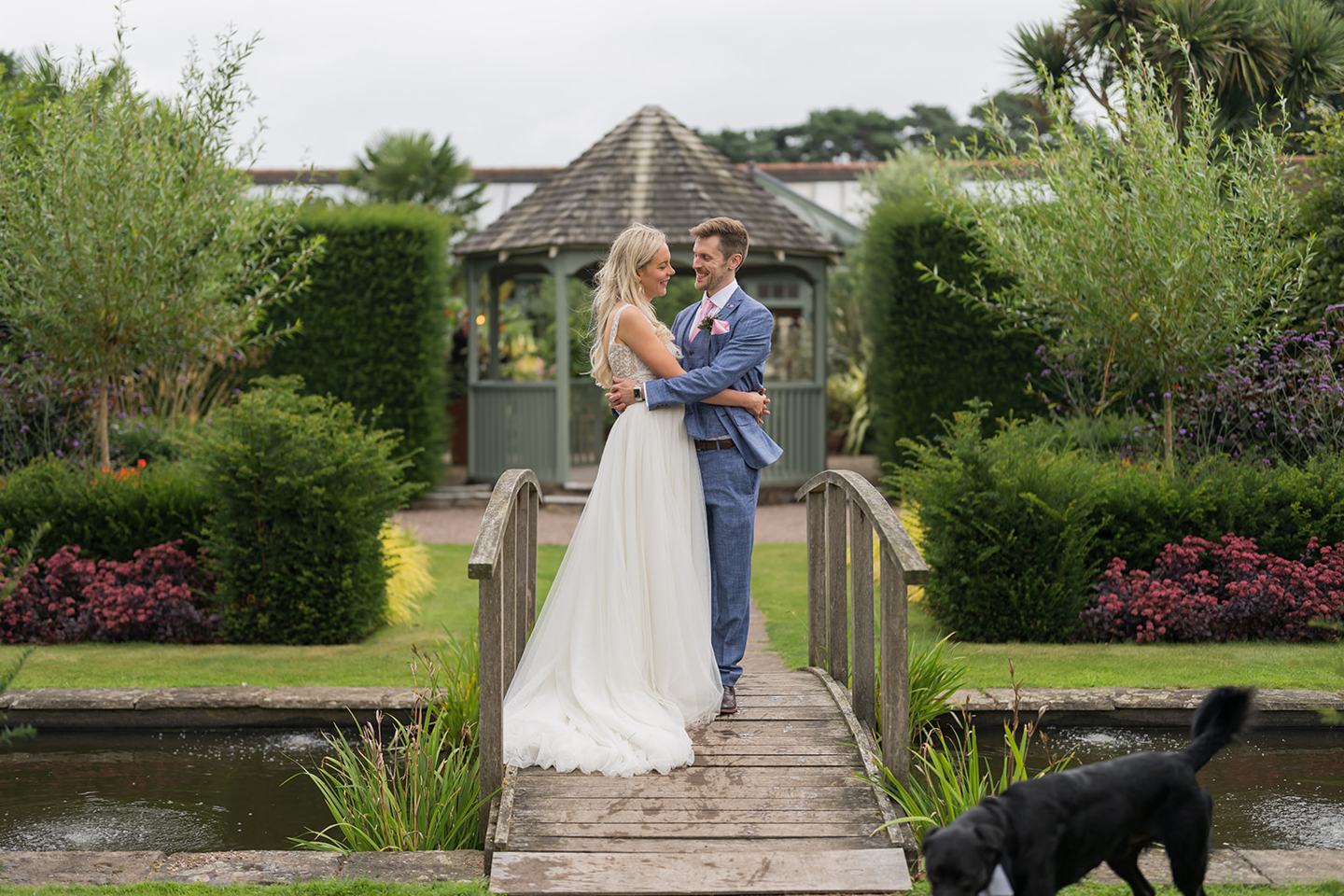 Portrait on the garden bridge at Annie and Joe’s Abbeywood Estate wedding