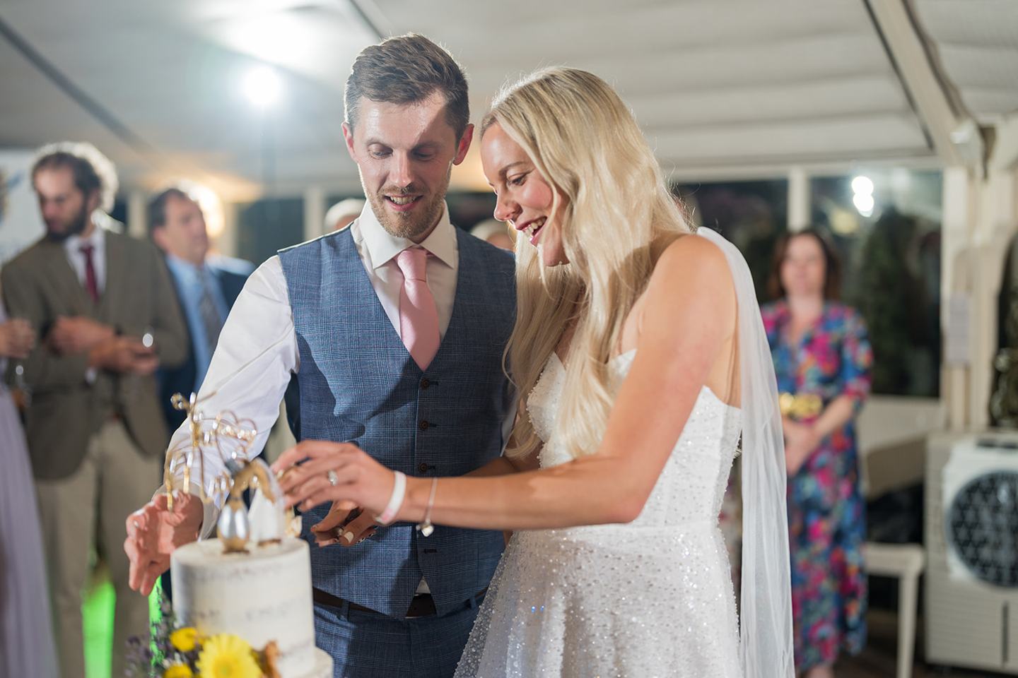 Cutting the cake at Annie and Joe’s Abbeywood Estate wedding