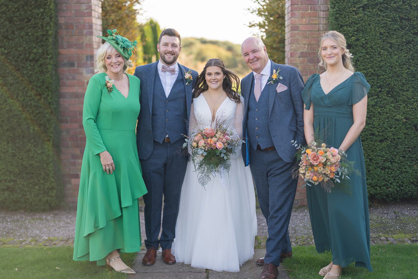 Family group in the gardens at Gemma and James’s Abbeywood Estate wedding
