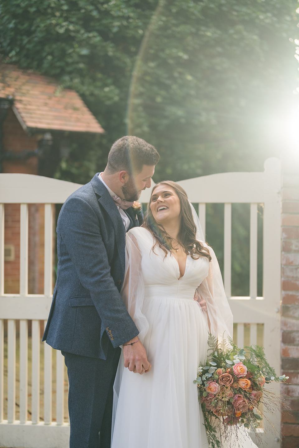 Golden light by the garden gate at Gemma and James’s Abbeywood Estate wedding