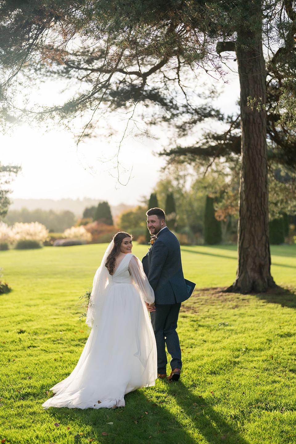Walking across the lawn at Gemma and James’s Abbeywood Estate wedding