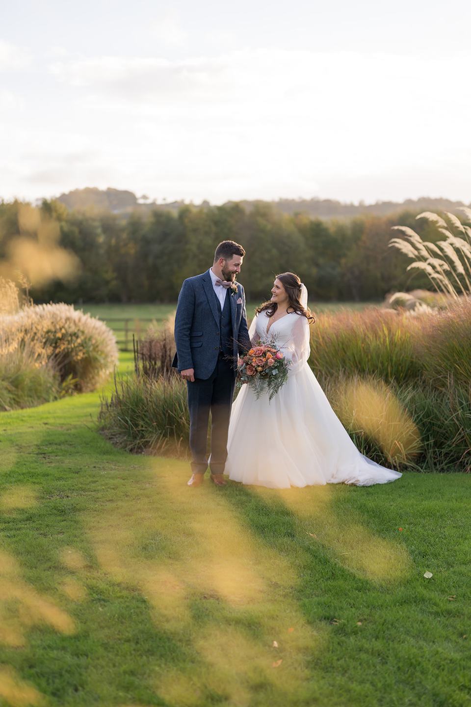 Portrait among the ornamental grasses at Gemma and James’s Abbeywood Estate wedding