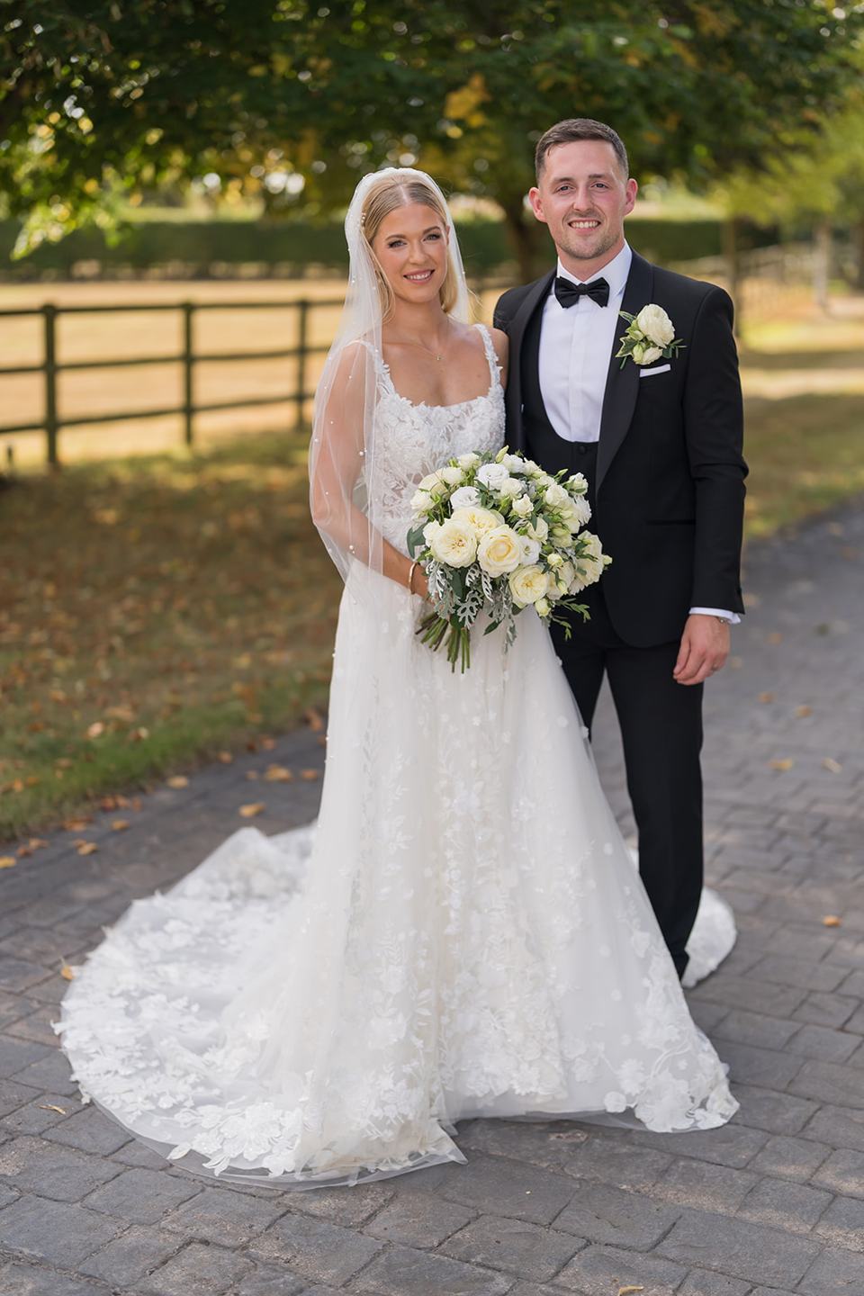 Couple portrait in the gardens at Evie and Josh’s Burlton Manor wedding