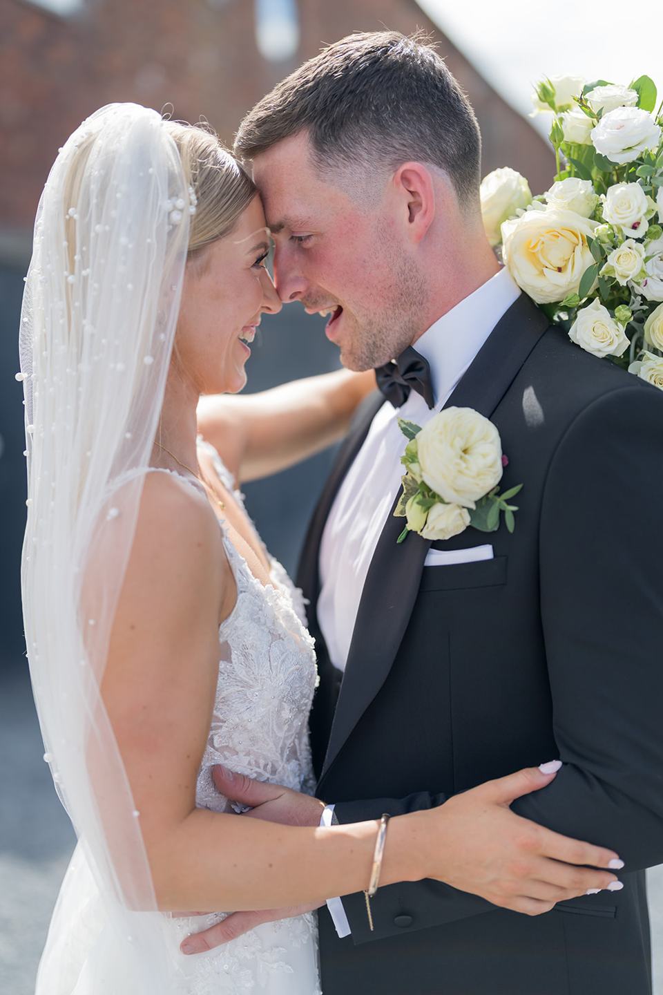 Newlyweds beneath the veil at Evie and Josh’s Burlton Manor wedding