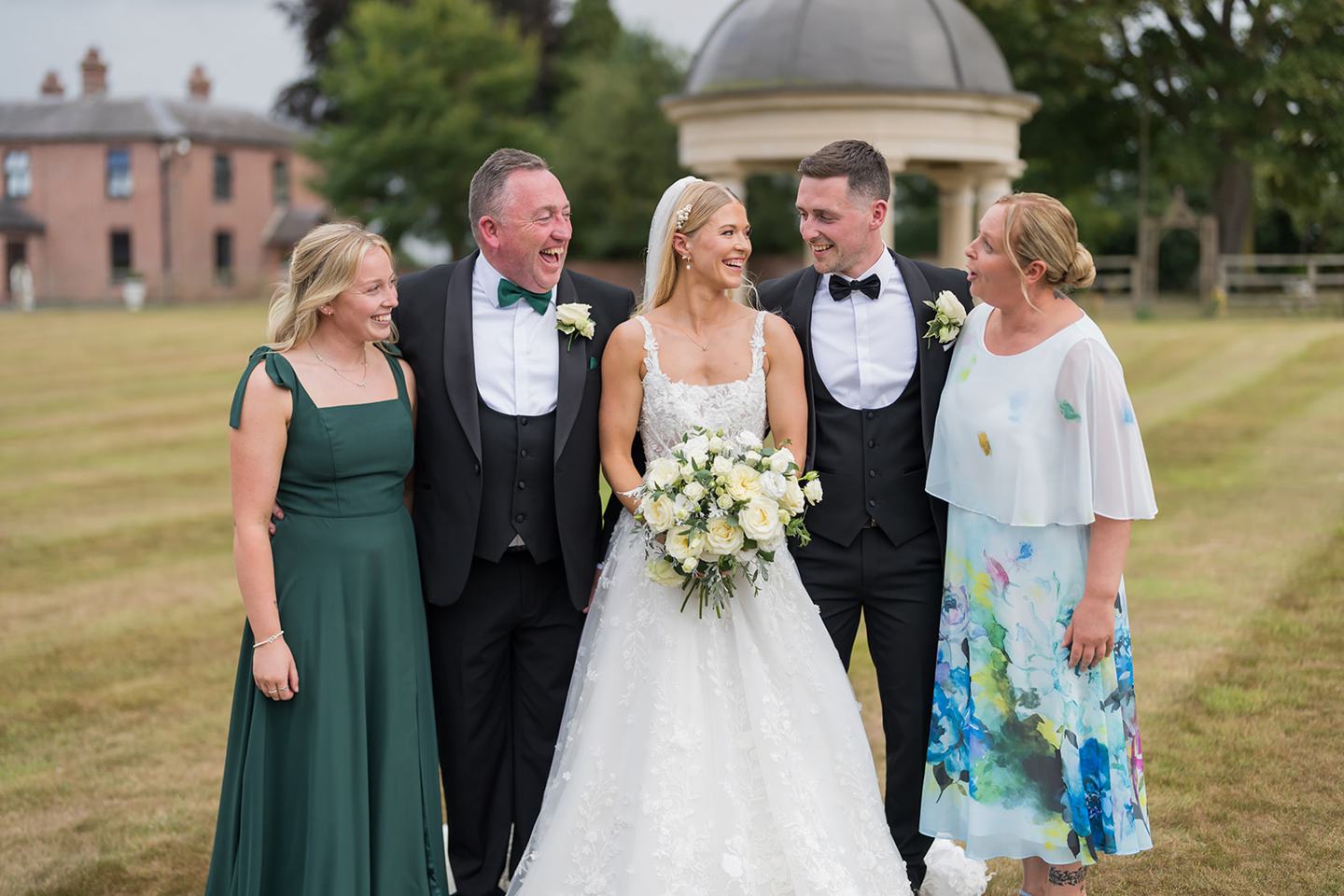Family photographs in the grounds at Evie and Josh’s Burlton Manor wedding