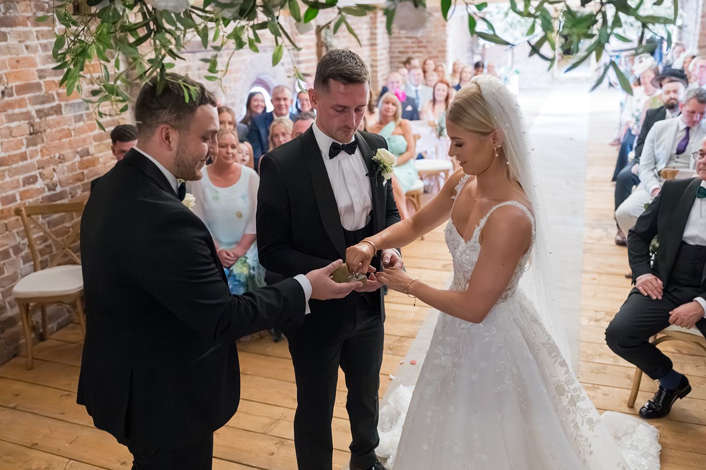 Exchanging vows at Evie and Josh’s Burlton Manor wedding