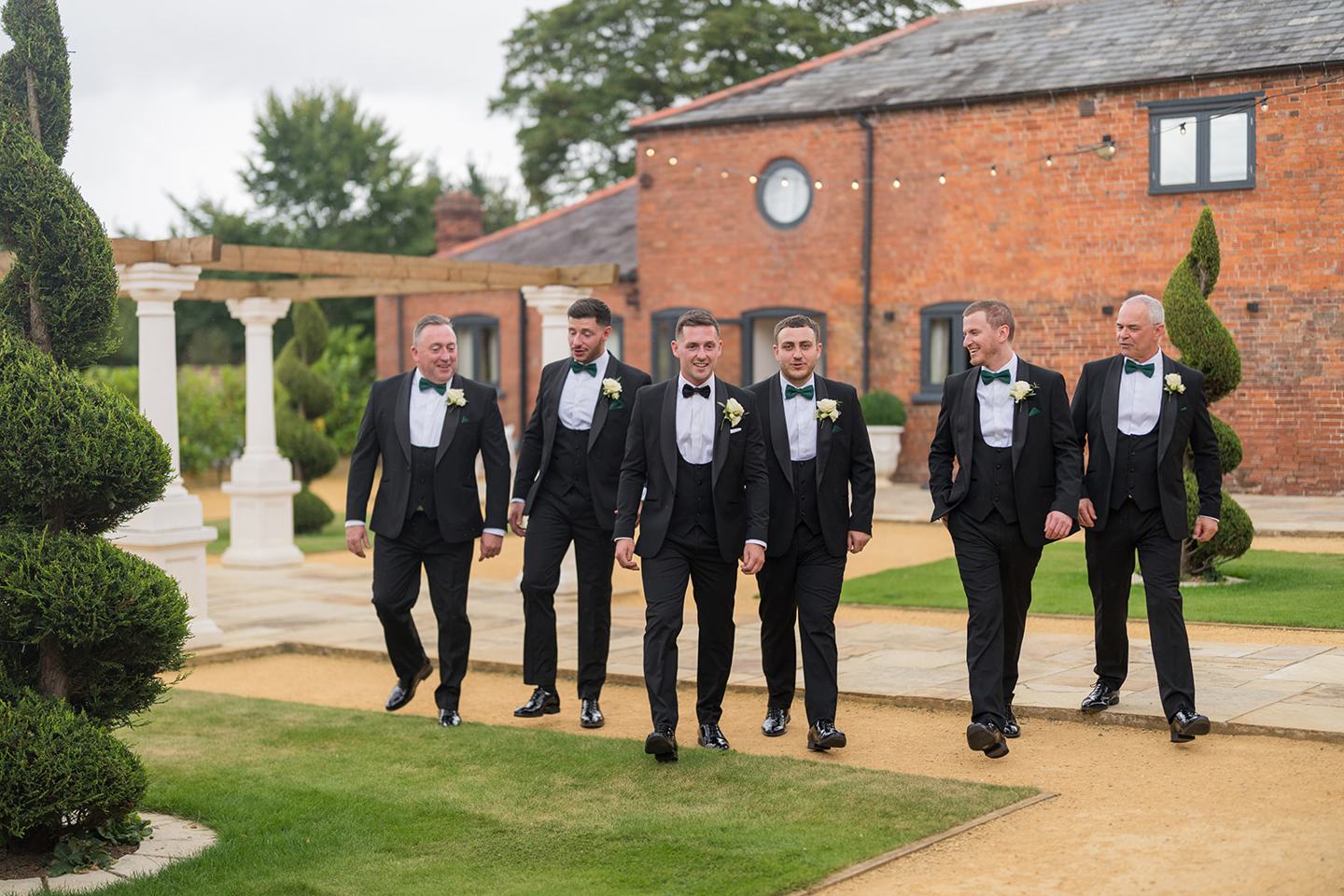 Groom with his wedding party at Evie and Josh’s Burlton Manor wedding