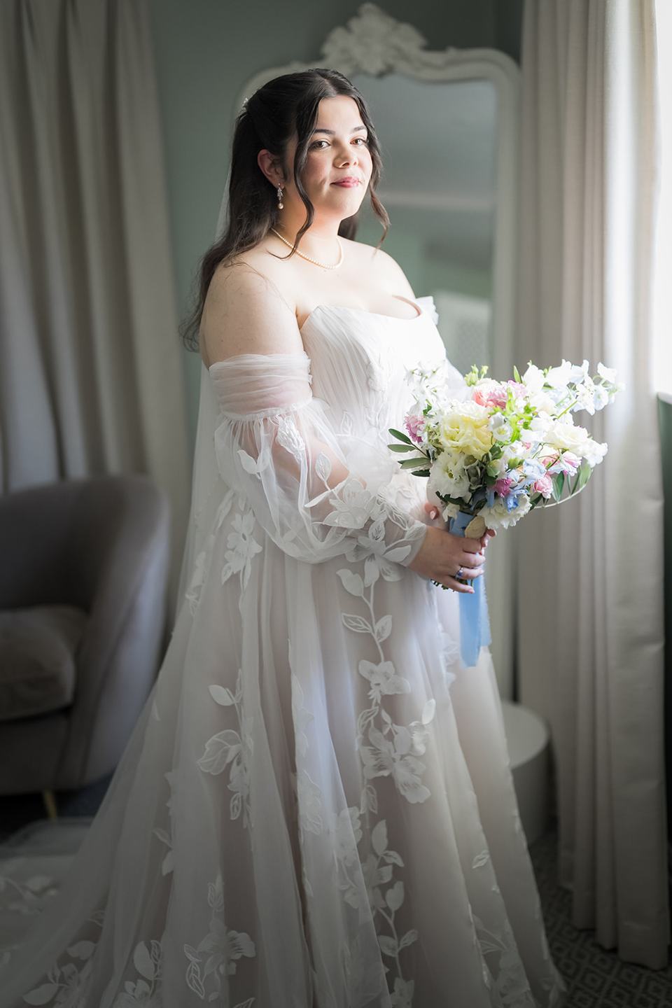 Bridal portrait by the window at Abi and Ben’s Combermere Abbey wedding