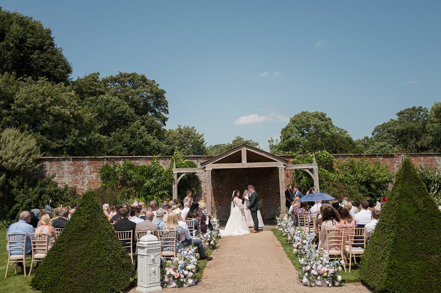 Garden wedding ceremony at Abi and Ben’s Combermere Abbey wedding