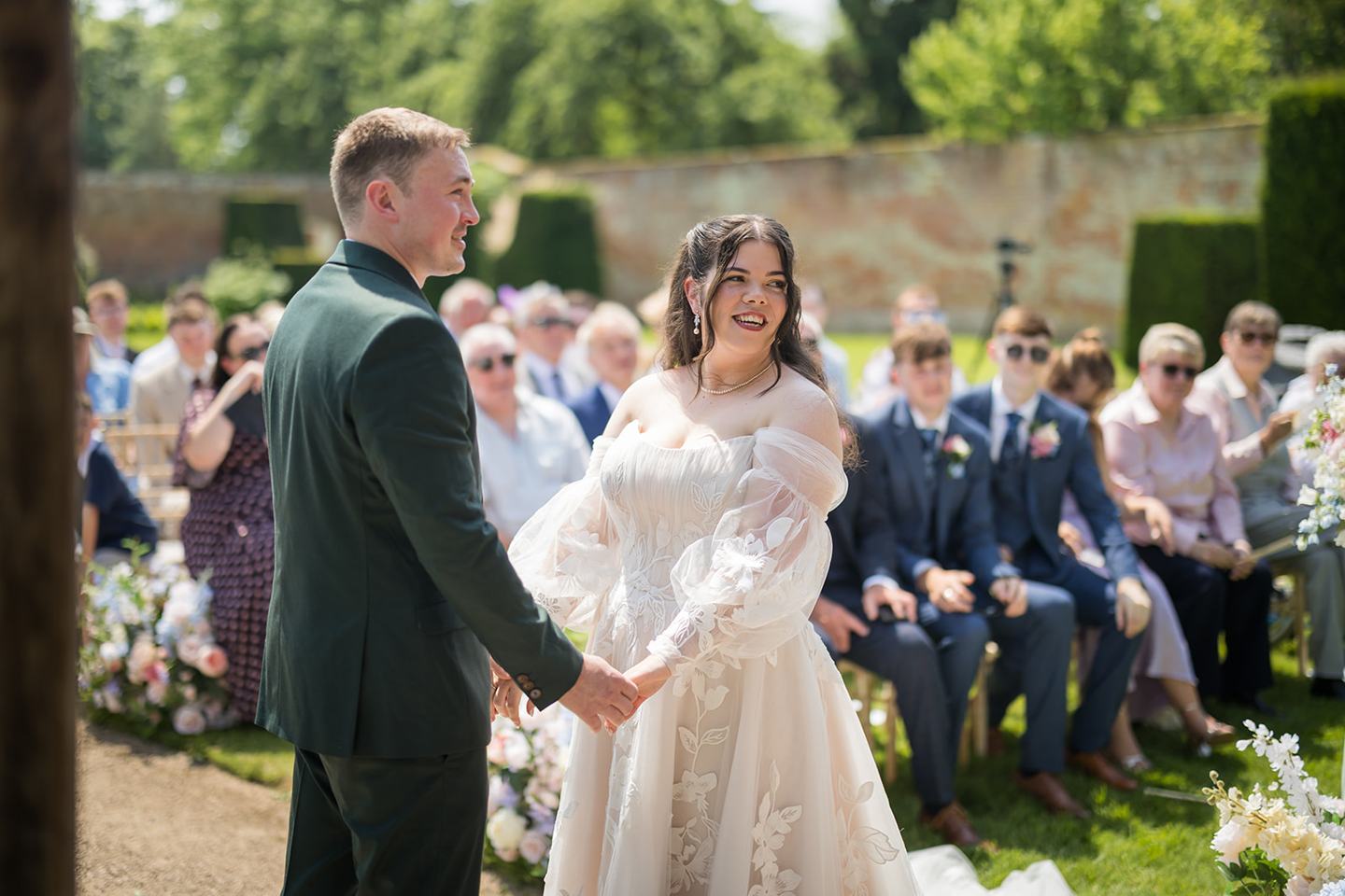 Exchanging wedding vows at Abi and Ben’s Combermere Abbey wedding