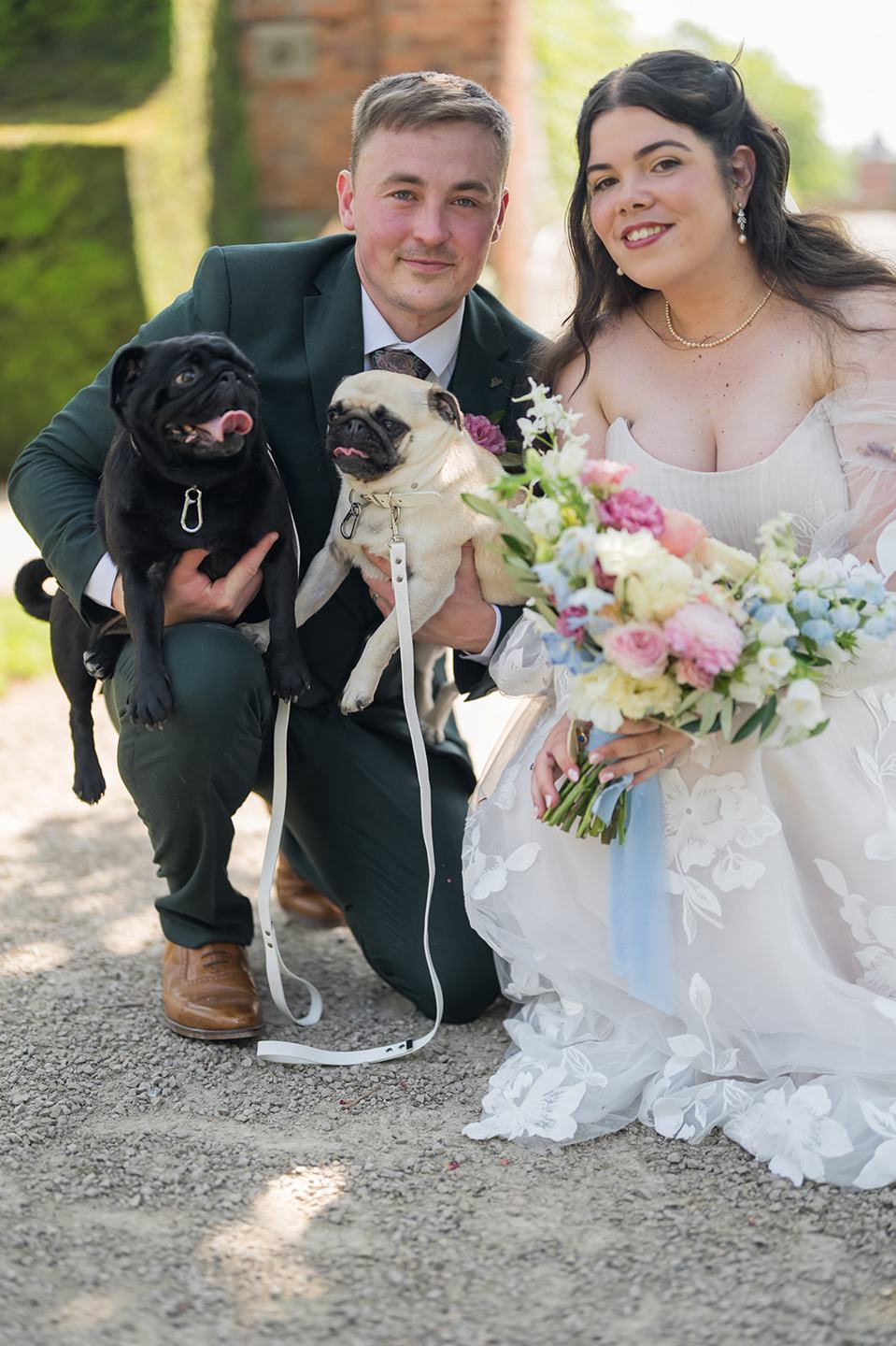 Newlyweds with their dog at Abi and Ben’s Combermere Abbey wedding