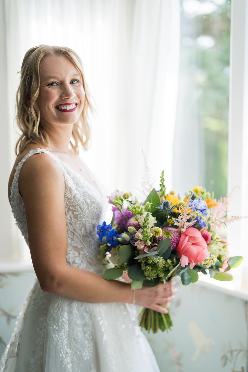 Bridal portrait by the window at Hannah and Jacob’s Combermere Abbey wedding