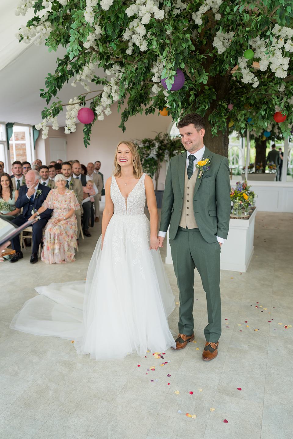 Couple during the glasshouse ceremony at Hannah and Jacob’s Combermere Abbey wedding