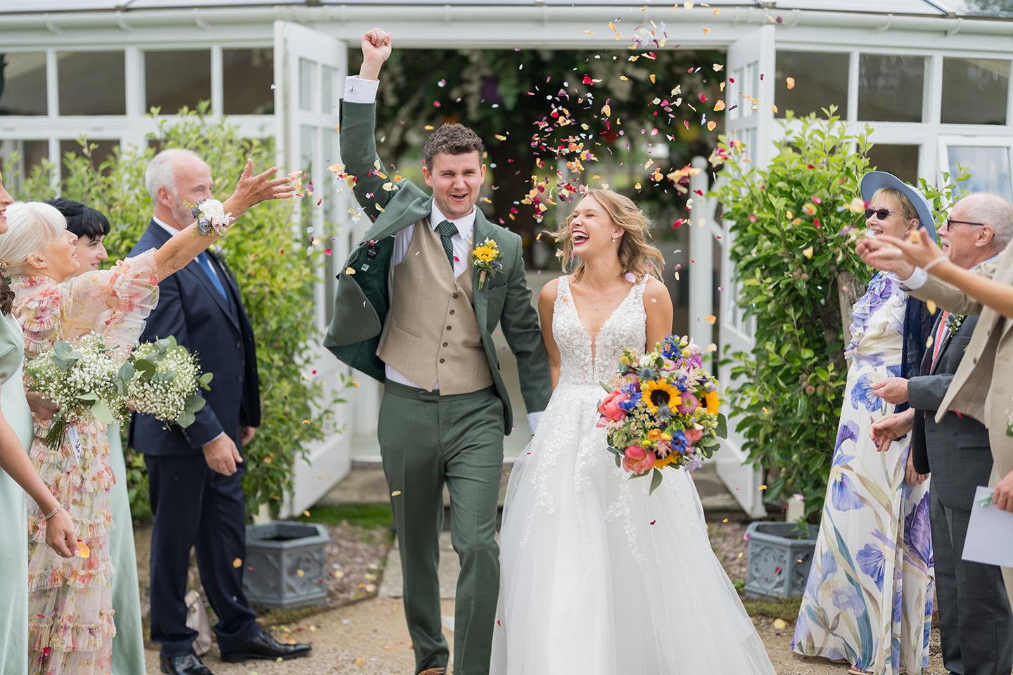 Confetti outside the glasshouse at Hannah and Jacob’s Combermere Abbey wedding