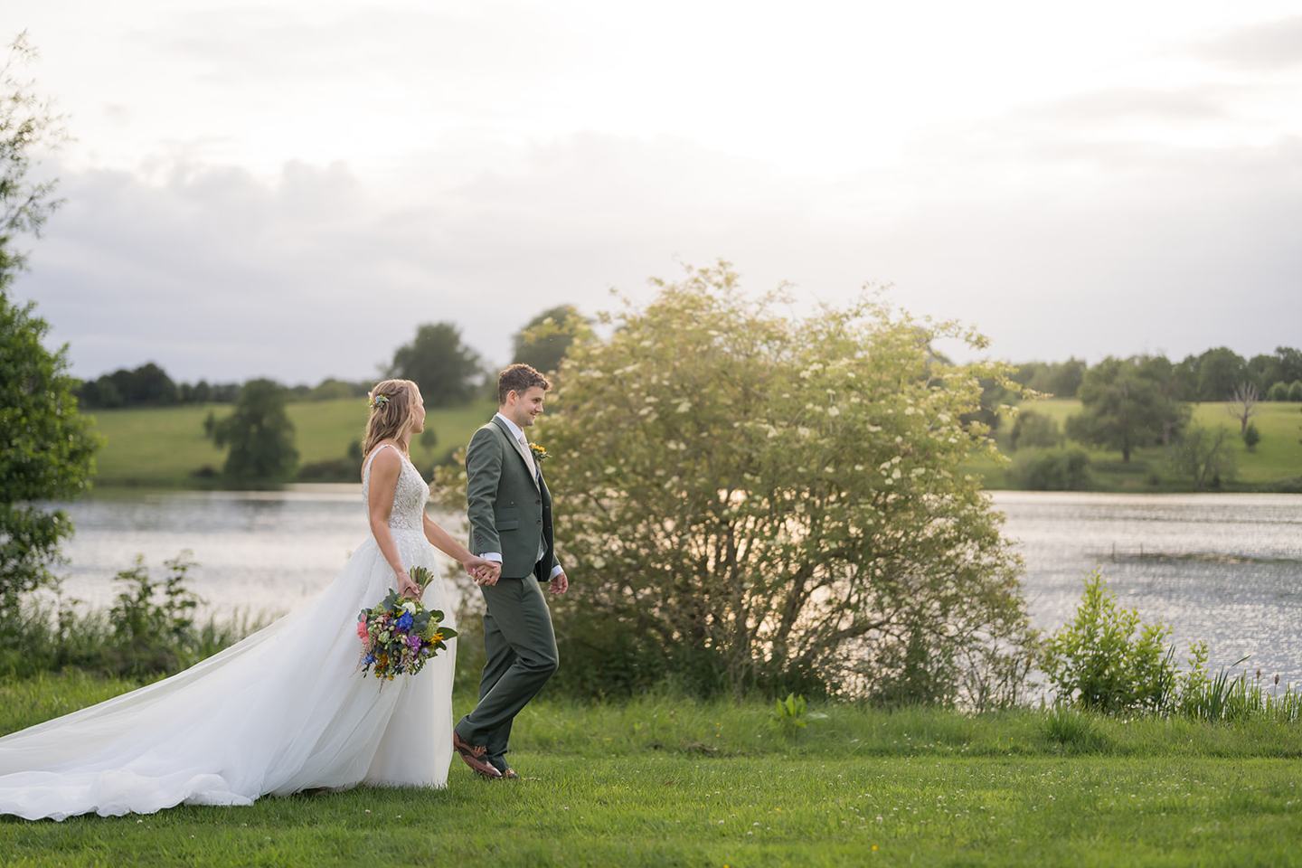 Couple beside the lake at Hannah and Jacob’s Combermere Abbey wedding