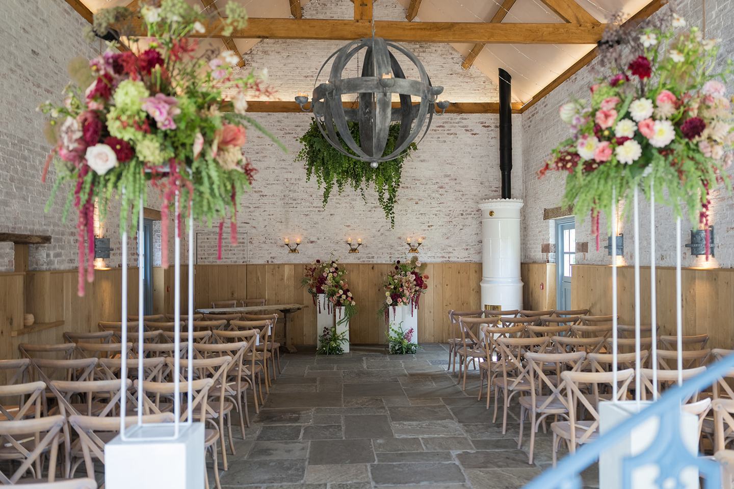 The ceremony room dressed with flowers at Lauren and Tom’s Dorfold Hall wedding
