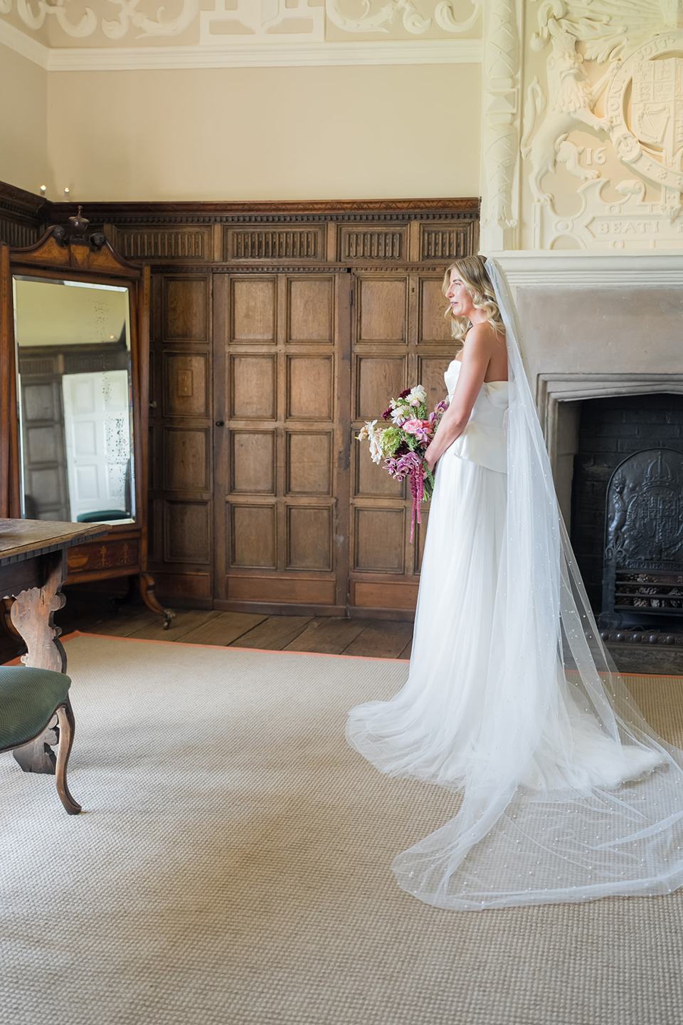 Bridal portrait in the hall at Lauren and Tom’s Dorfold Hall wedding