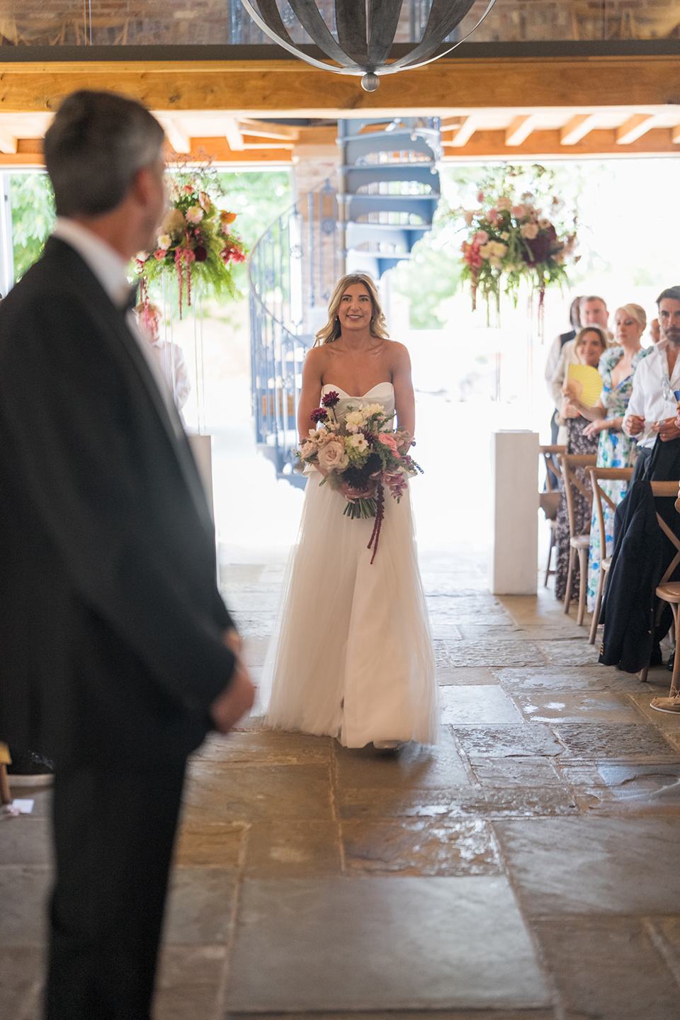 Arriving for the ceremony at Lauren and Tom’s Dorfold Hall wedding