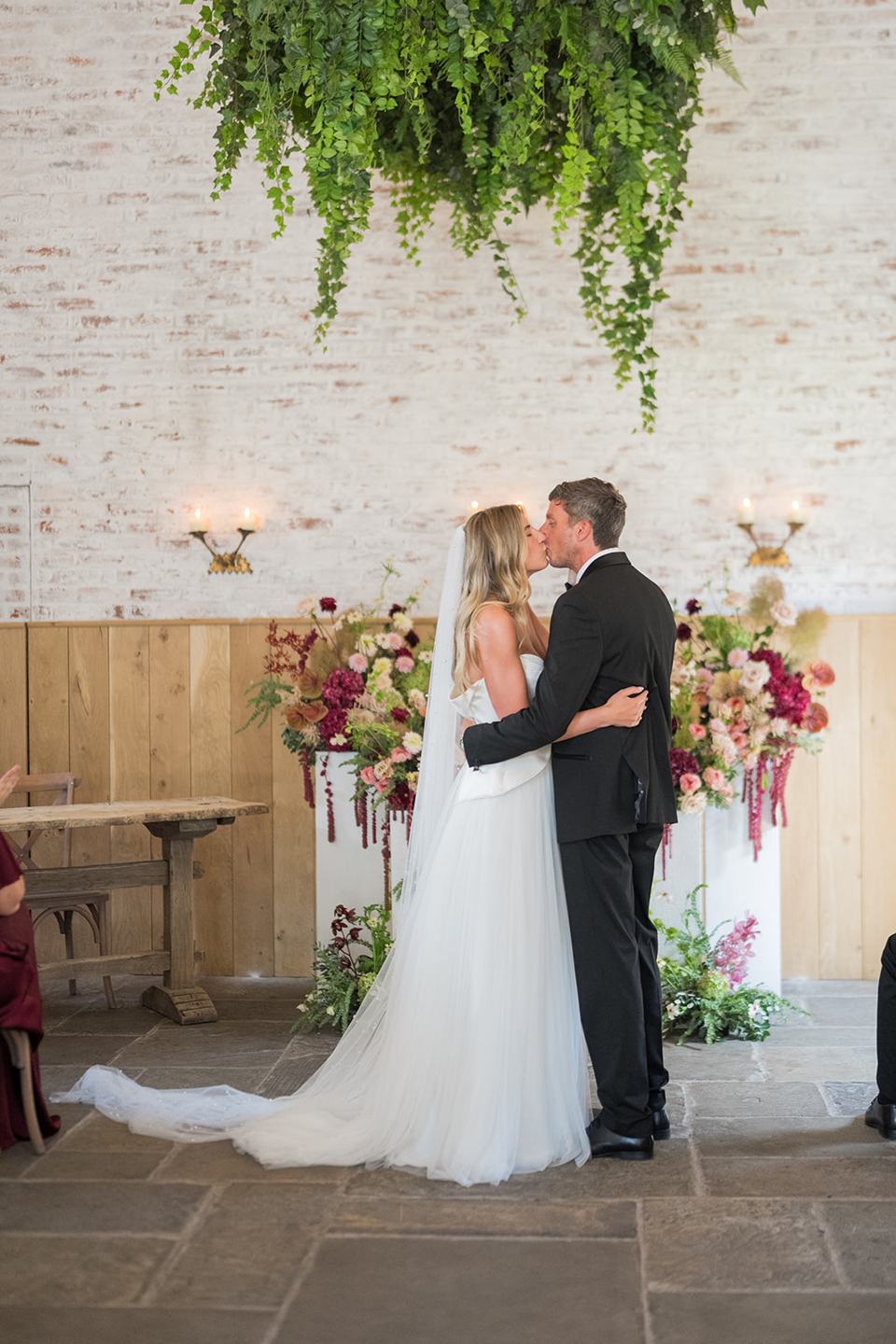 The first kiss at Lauren and Tom’s Dorfold Hall wedding