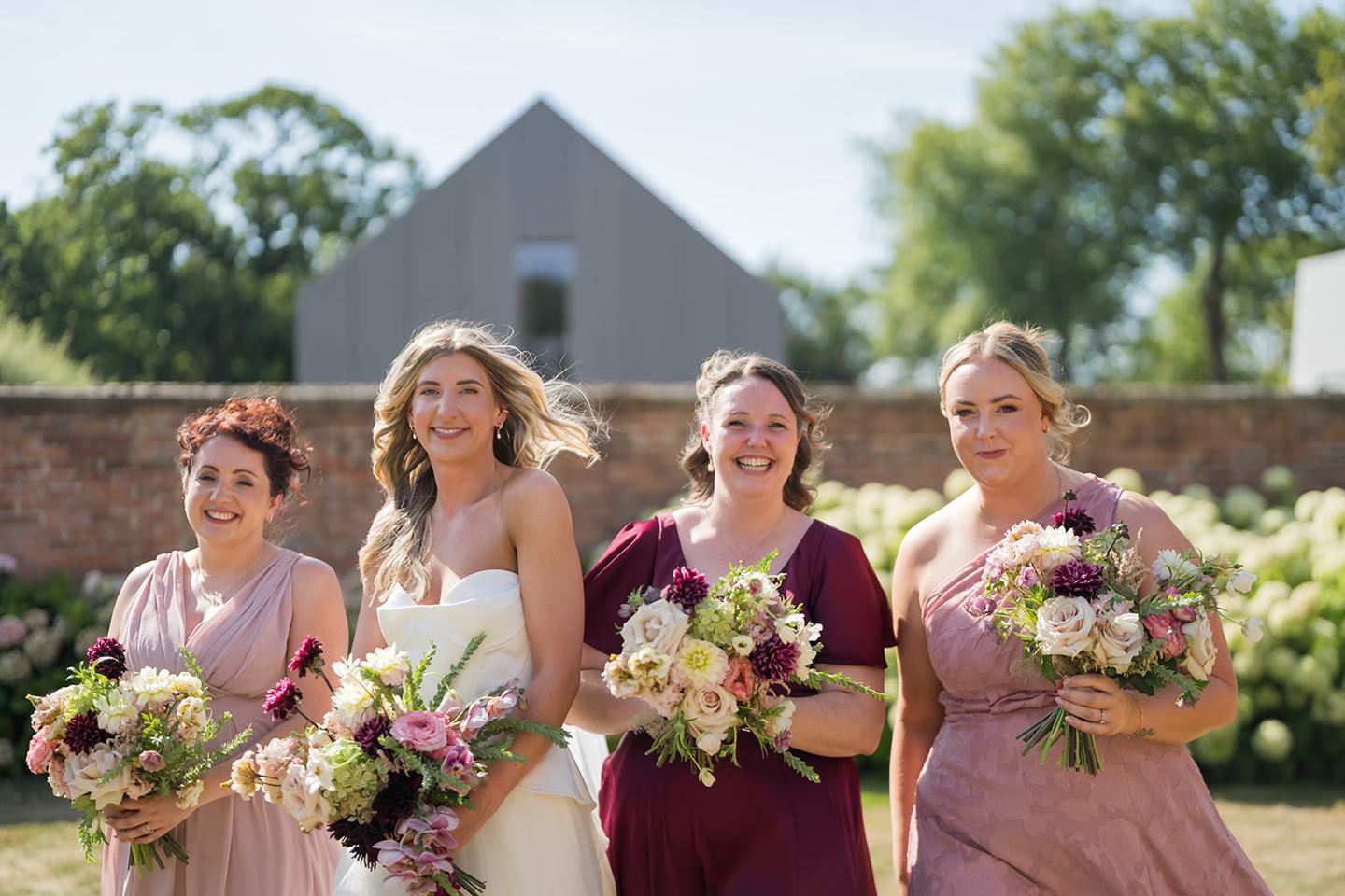 Bridesmaids celebrating at Lauren and Tom’s Dorfold Hall wedding