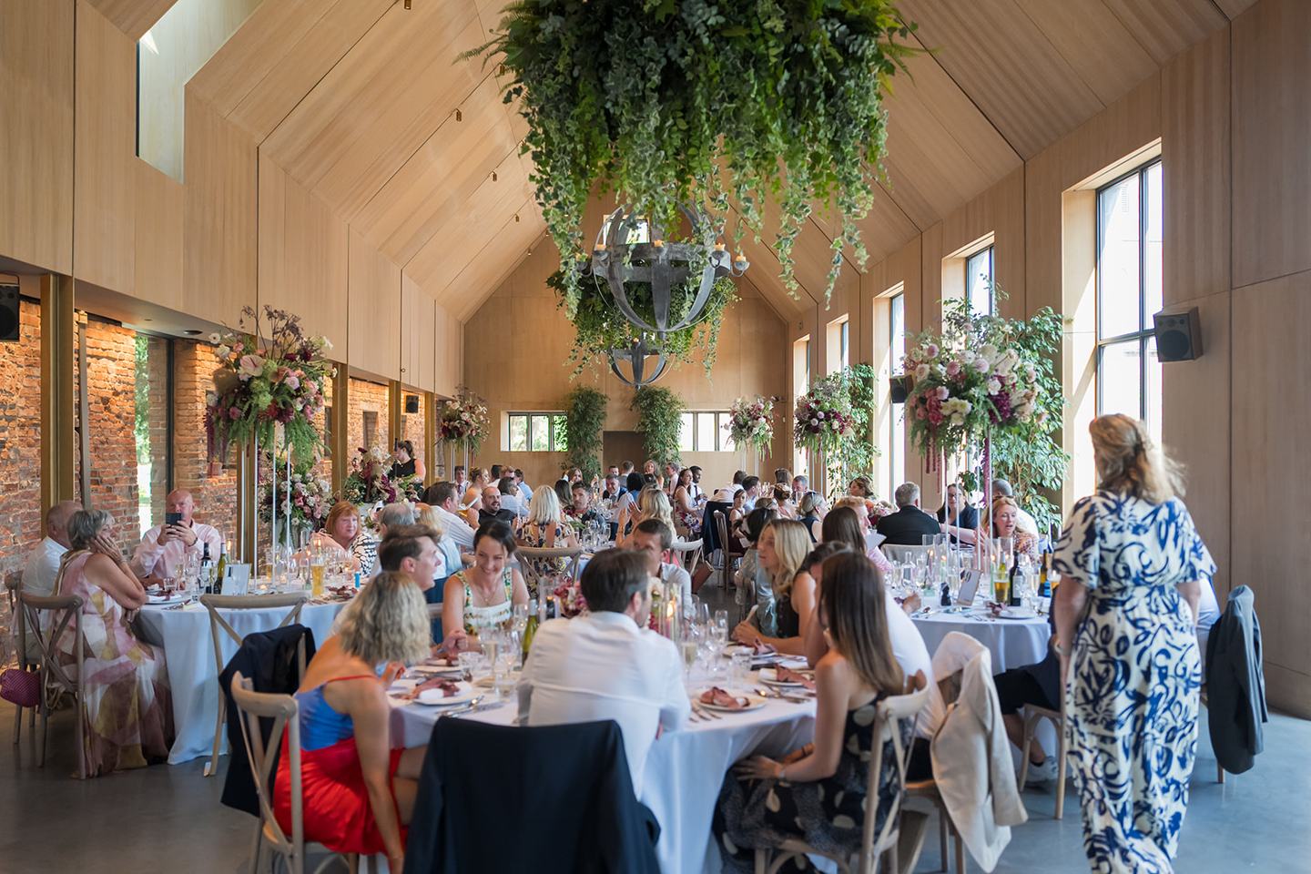 Guests at the wedding breakfast at Lauren and Tom’s Dorfold Hall wedding