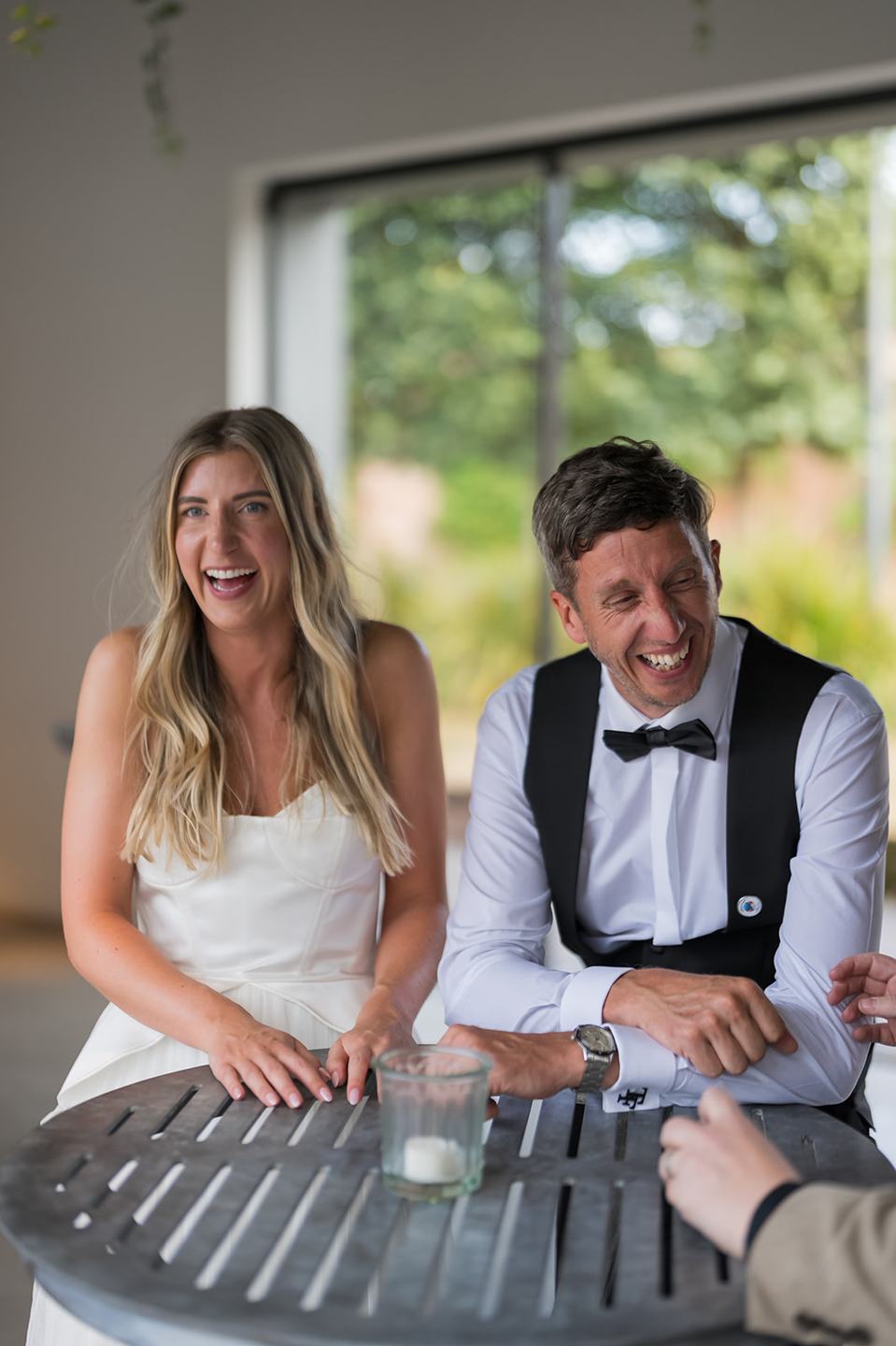 Newlyweds enjoying the reception at Lauren and Tom’s Dorfold Hall wedding