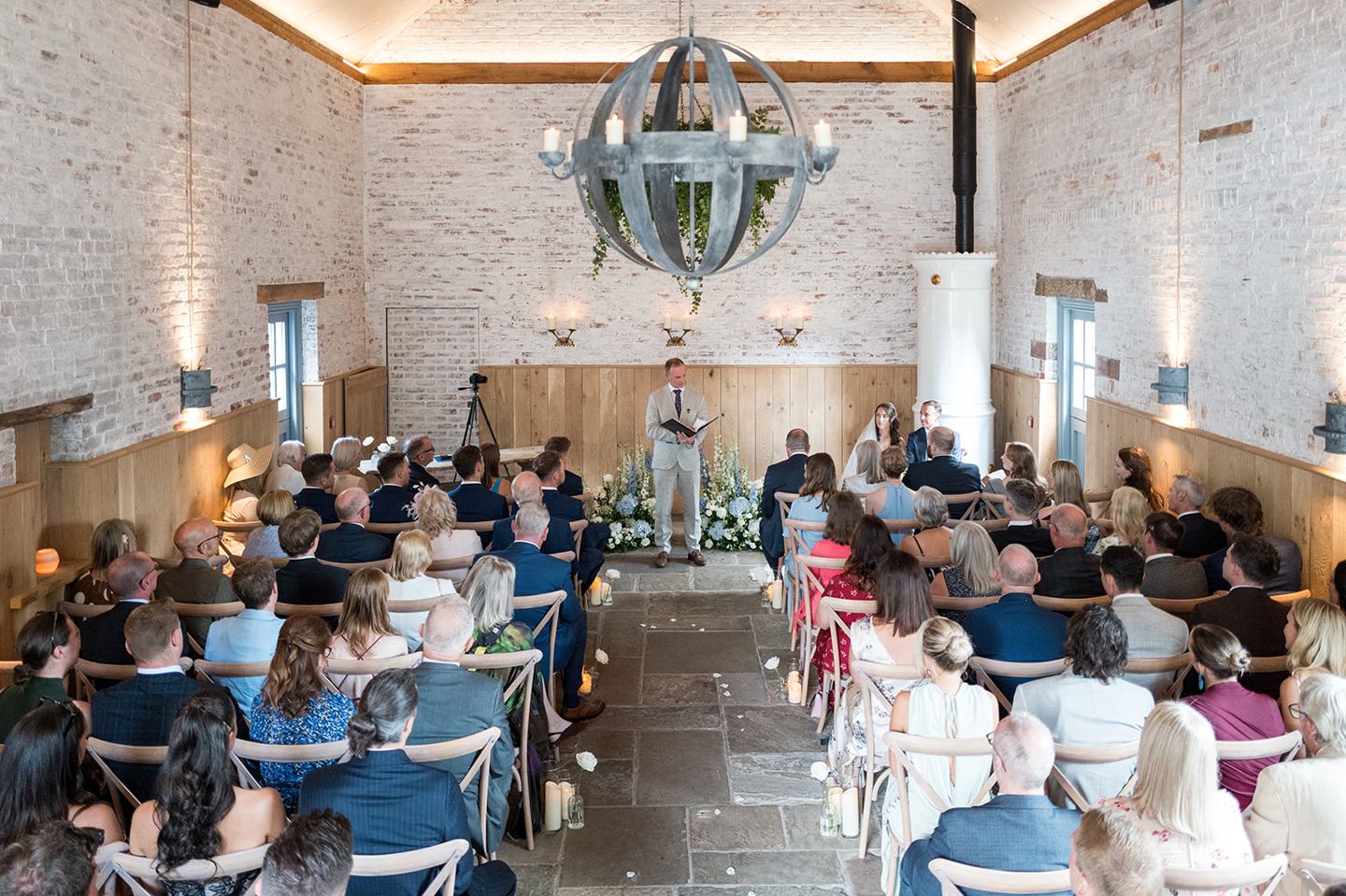 The ceremony with guests at Lizzie and Jack’s Dorfold Hall wedding