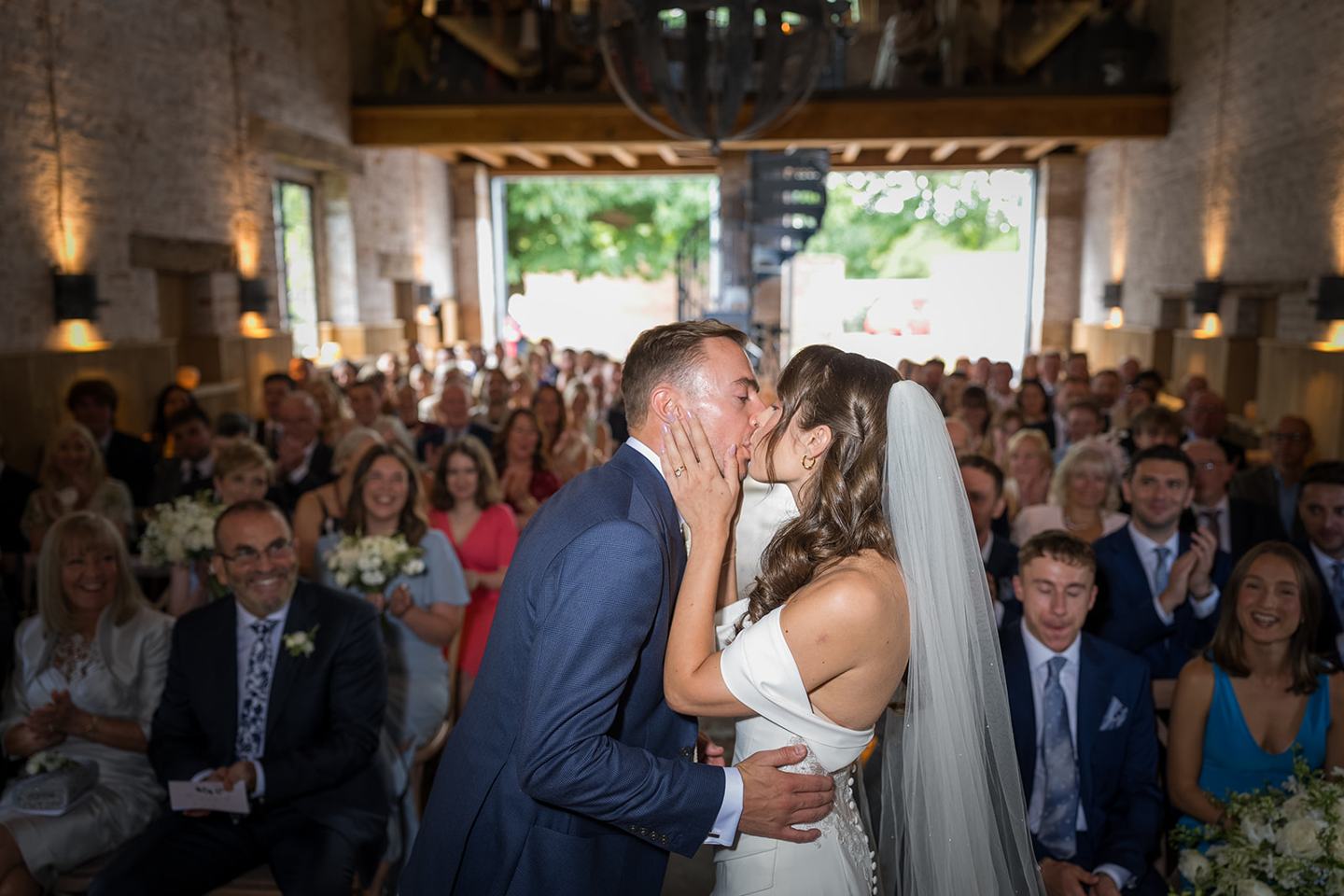 The first kiss at Lizzie and Jack’s Dorfold Hall wedding