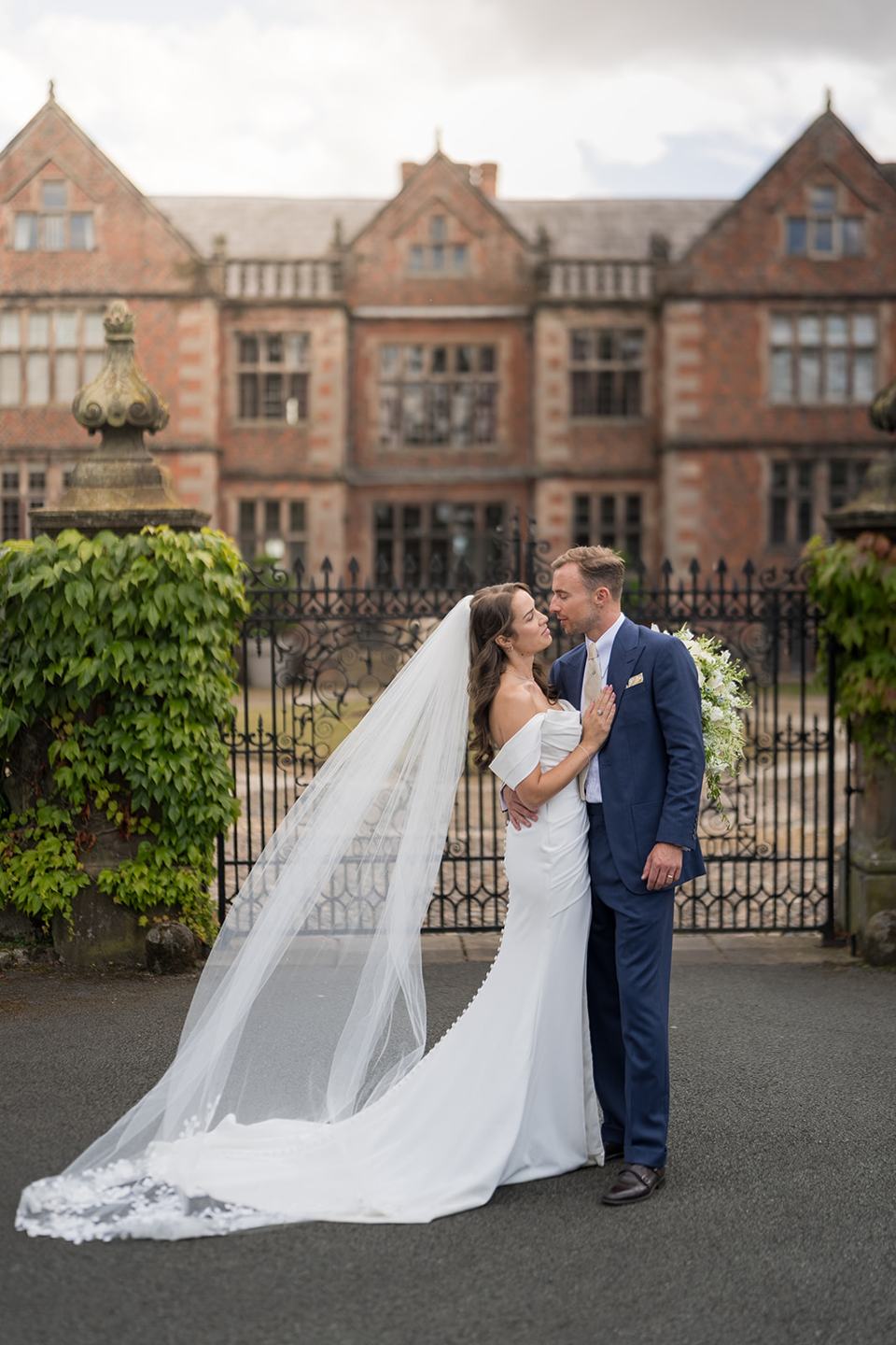 Newlyweds at the entrance at Lizzie and Jack’s Dorfold Hall wedding